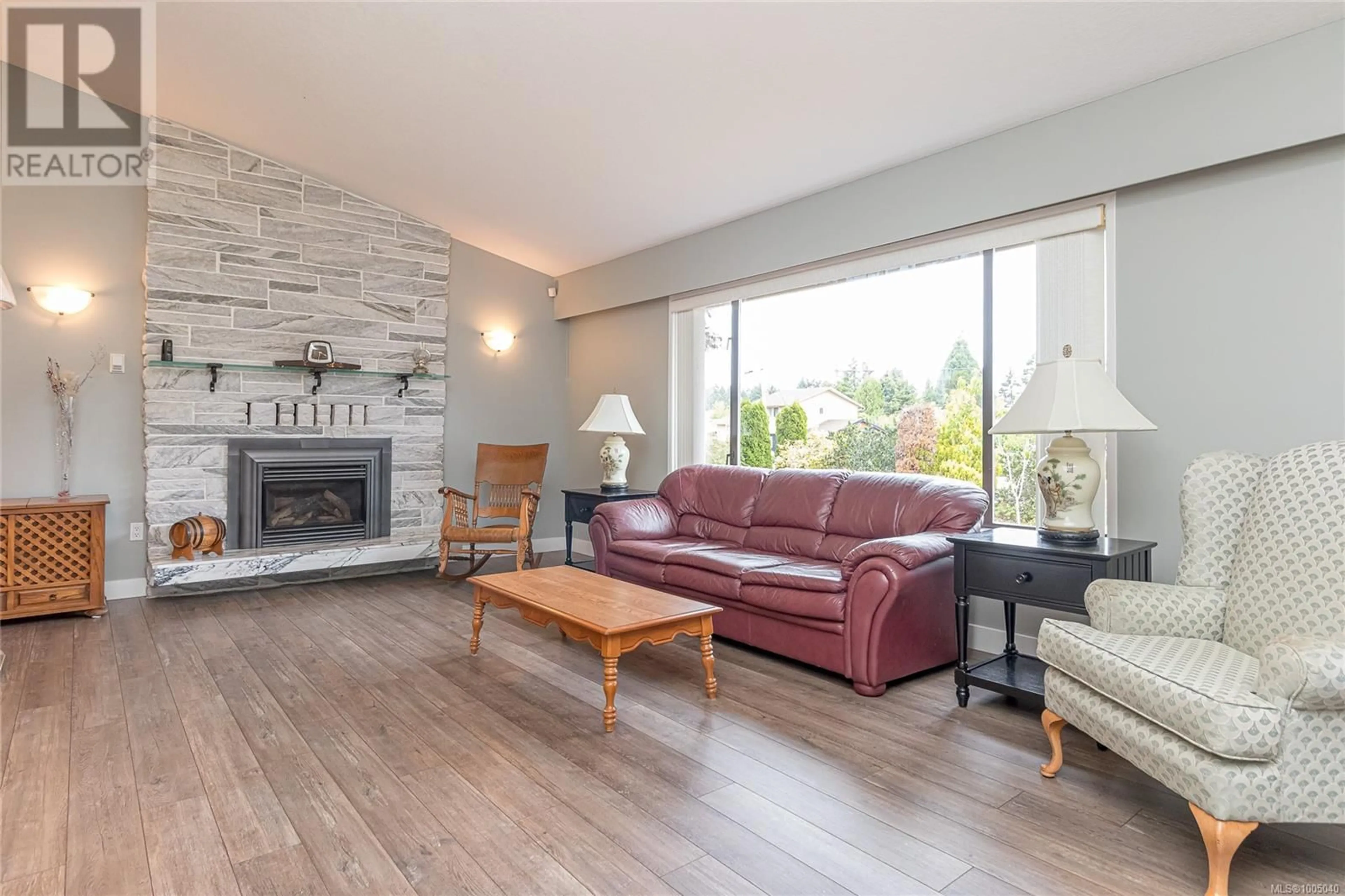 Living room with furniture, wood/laminate floor for 1376 GREENWOOD WAY, French Creek British Columbia V9P1X1