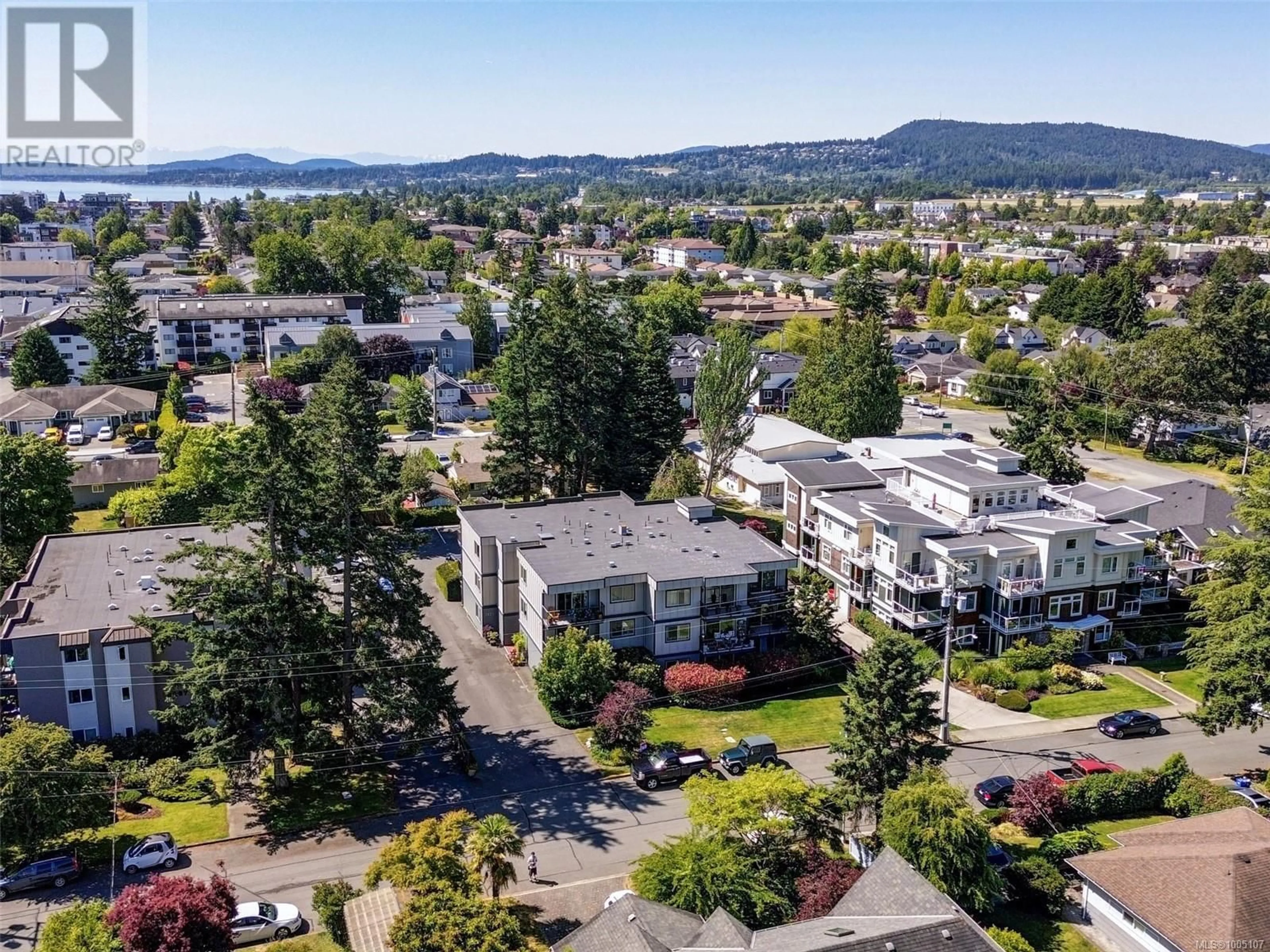 A pic from outside/outdoor area/front of a property/back of a property/a pic from drone, water/lake/river/ocean view for 203 - 2427 AMHERST AVENUE, Sidney British Columbia V8L2H1