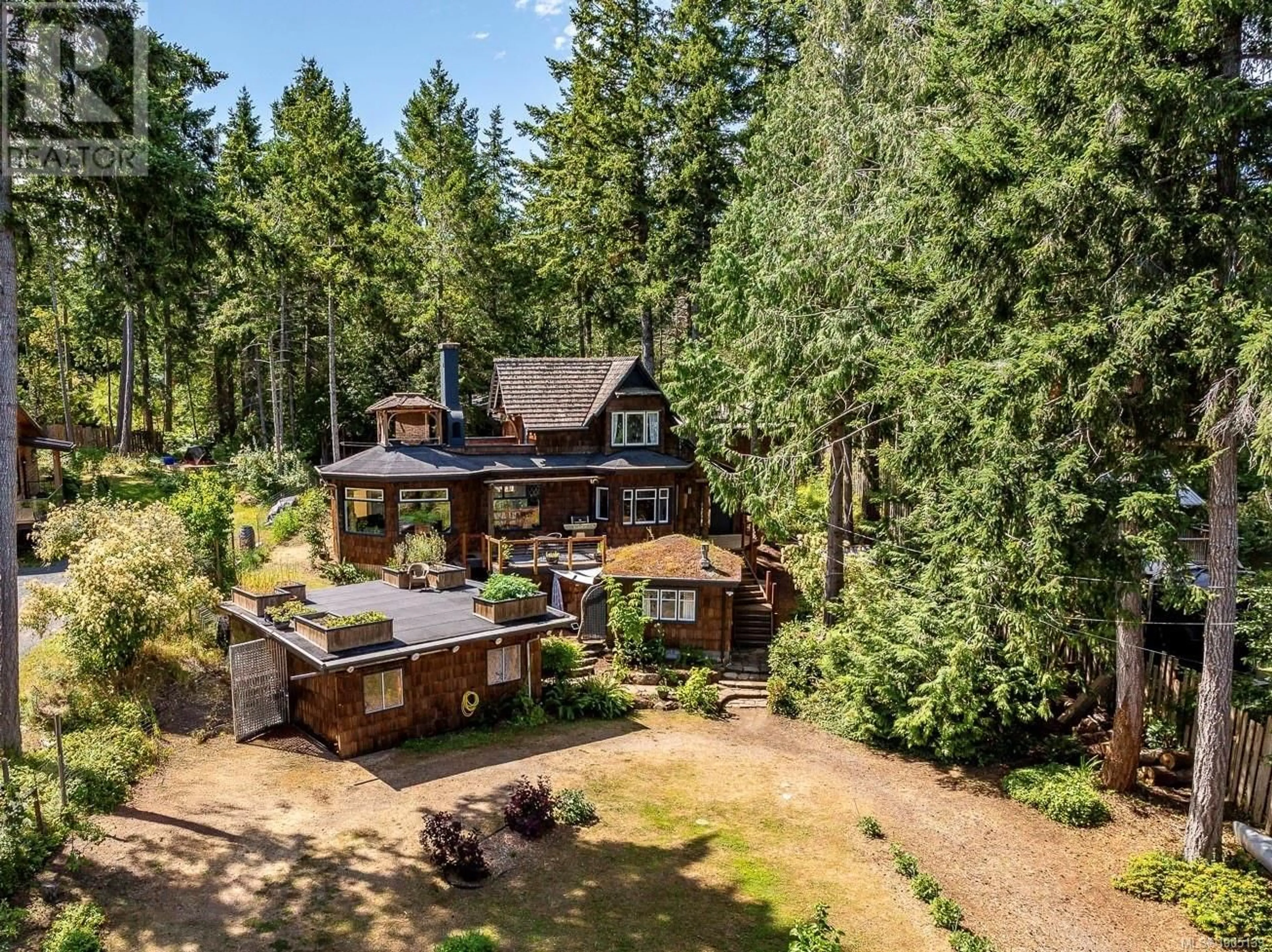 A pic from outside/outdoor area/front of a property/back of a property/a pic from drone, forest/trees view for 3160 HARWOOD ROAD, Hornby Island British Columbia V0R1Z0