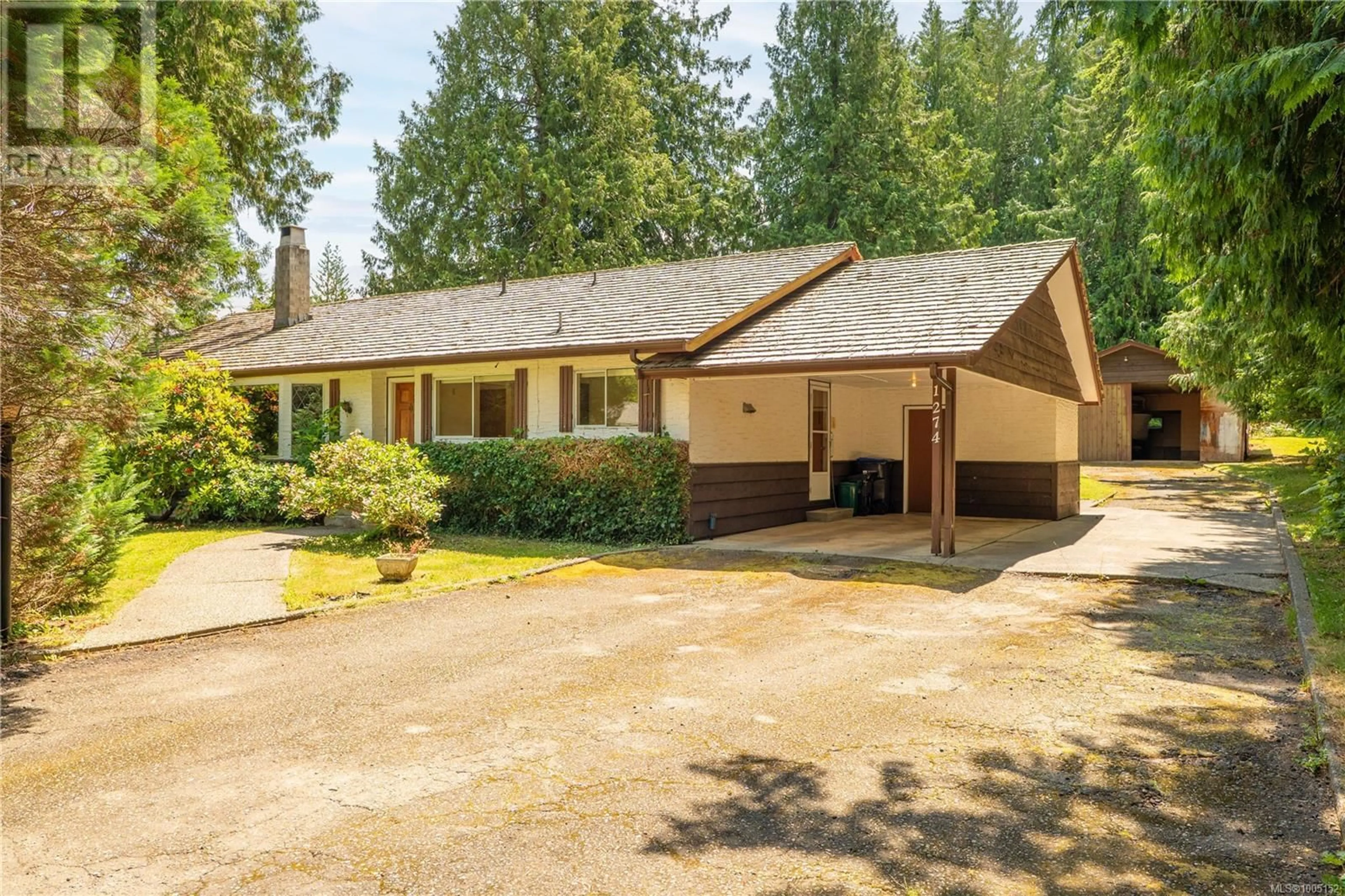 Home with vinyl exterior material, street for 1274 CENTRE ROAD, Qualicum Beach British Columbia V9K2G3