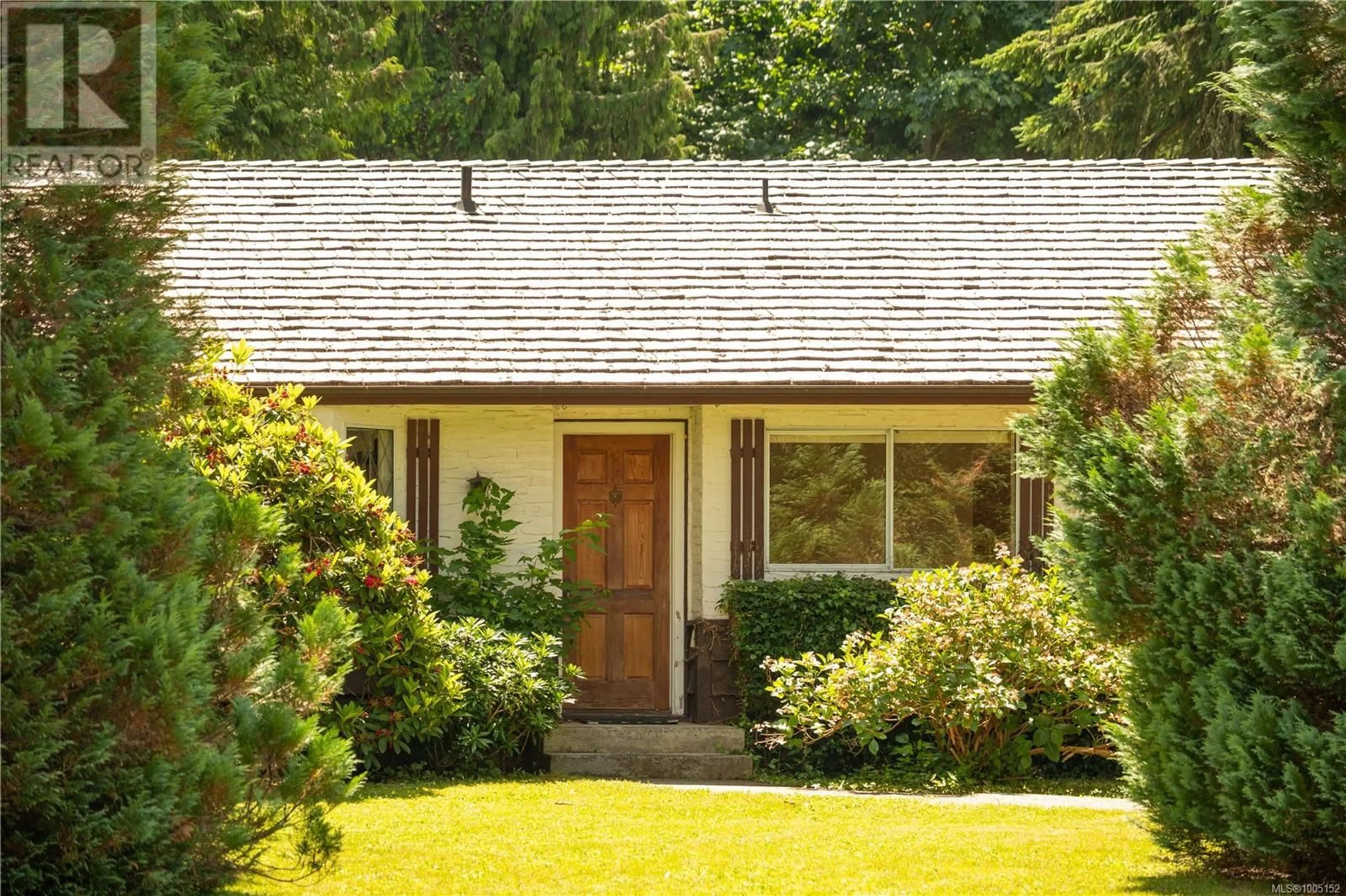 Home with vinyl exterior material, street for 1274 CENTRE ROAD, Qualicum Beach British Columbia V9K2G3