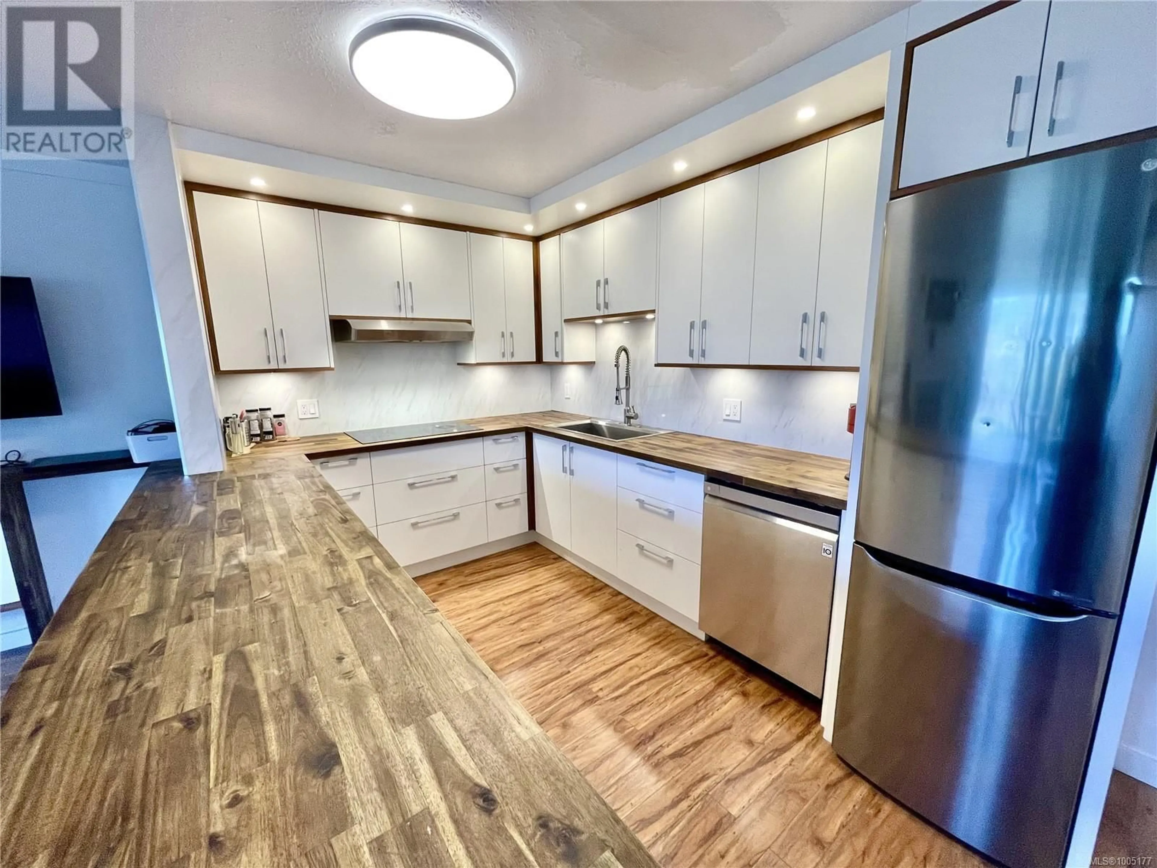 Open concept kitchen, wood/laminate floor for 106 - 1991 KALTASIN ROAD, Sooke British Columbia V9Z0B7