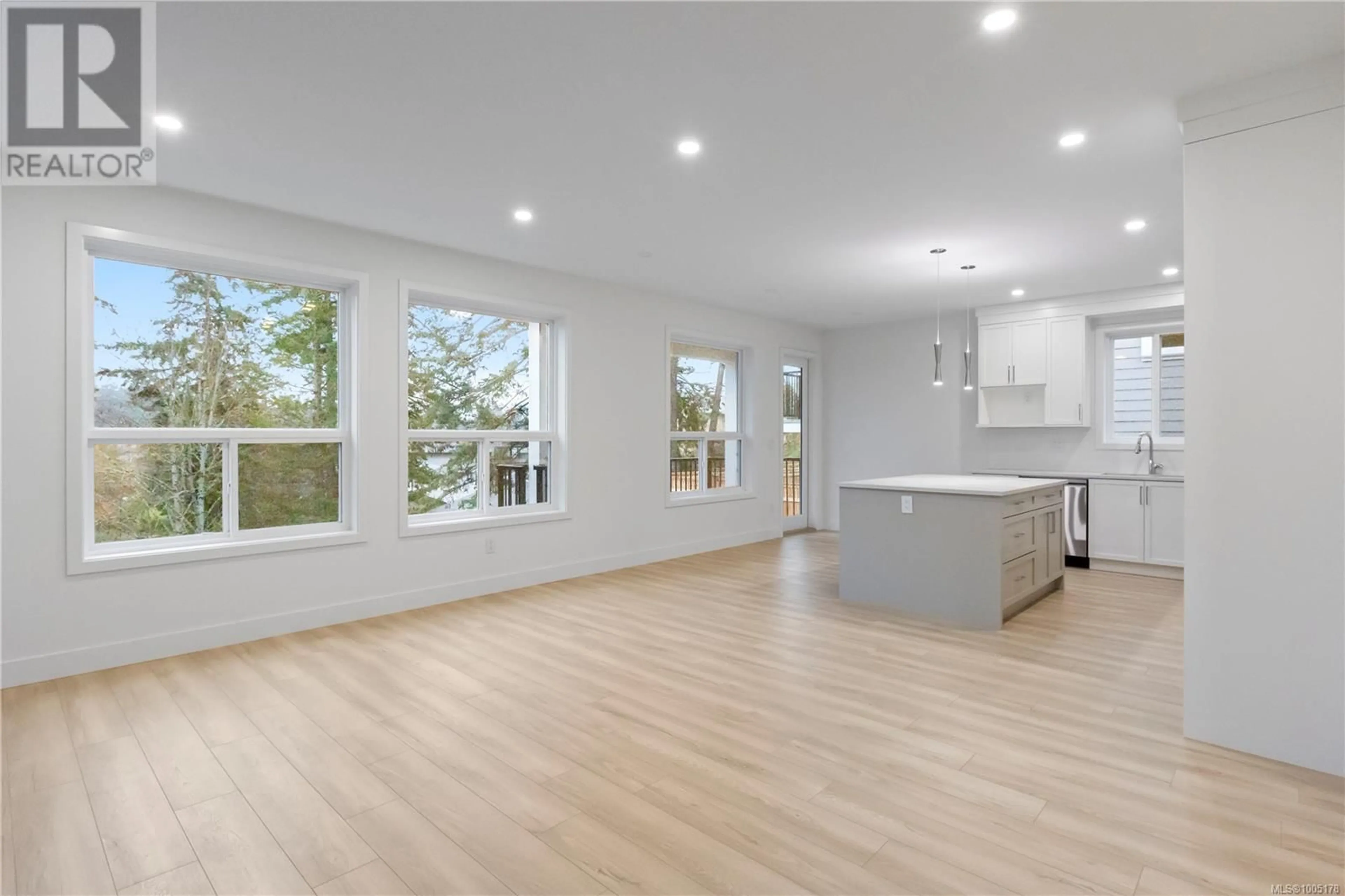 Open concept kitchen, wood/laminate floor for 2343 SWALLOW PLACE, Langford British Columbia V9B6Y6