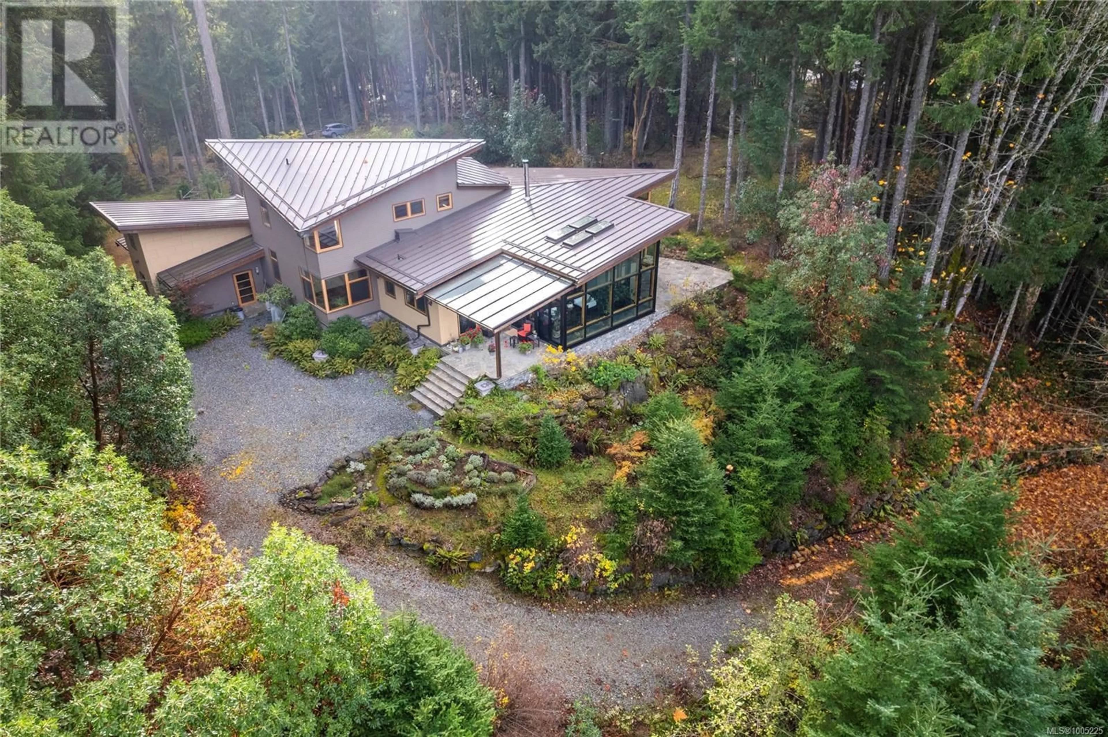 A pic from outside/outdoor area/front of a property/back of a property/a pic from drone, forest/trees view for 4985 AHO ROAD, Ladysmith British Columbia V9G2B8