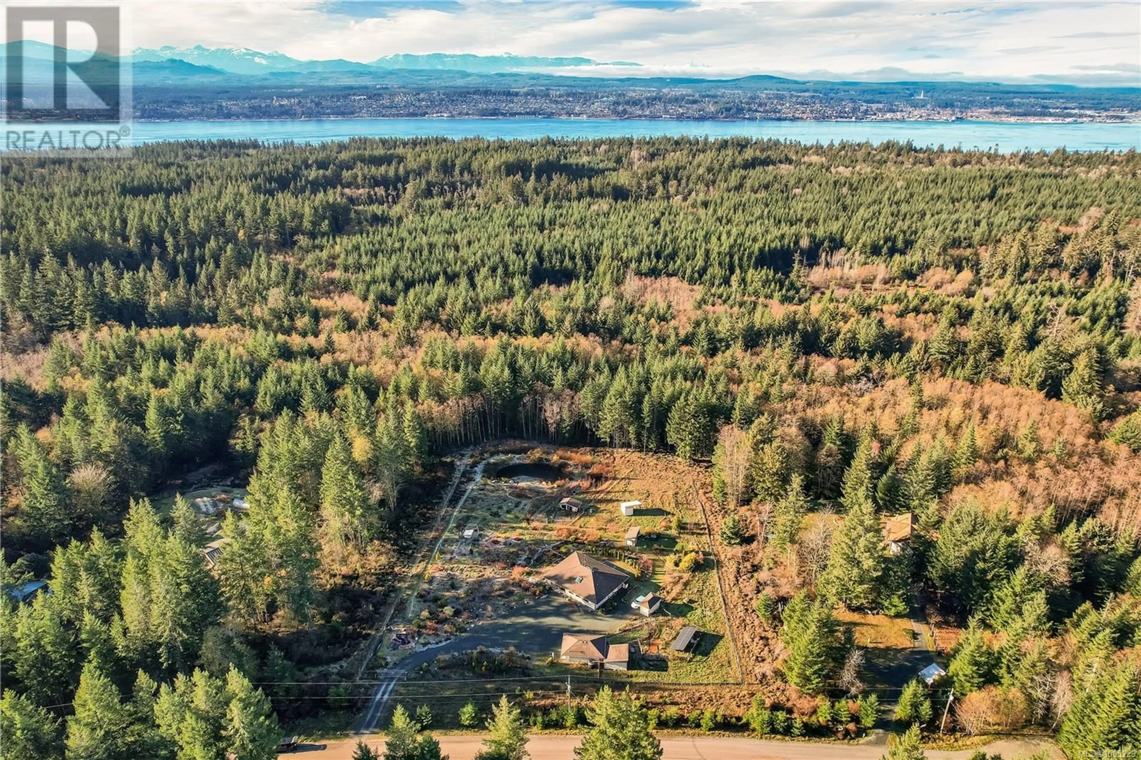 A pic from outside/outdoor area/front of a property/back of a property/a pic from drone, forest/trees view for 220 IRENE ROAD, Quadra Island British Columbia V0P1N0