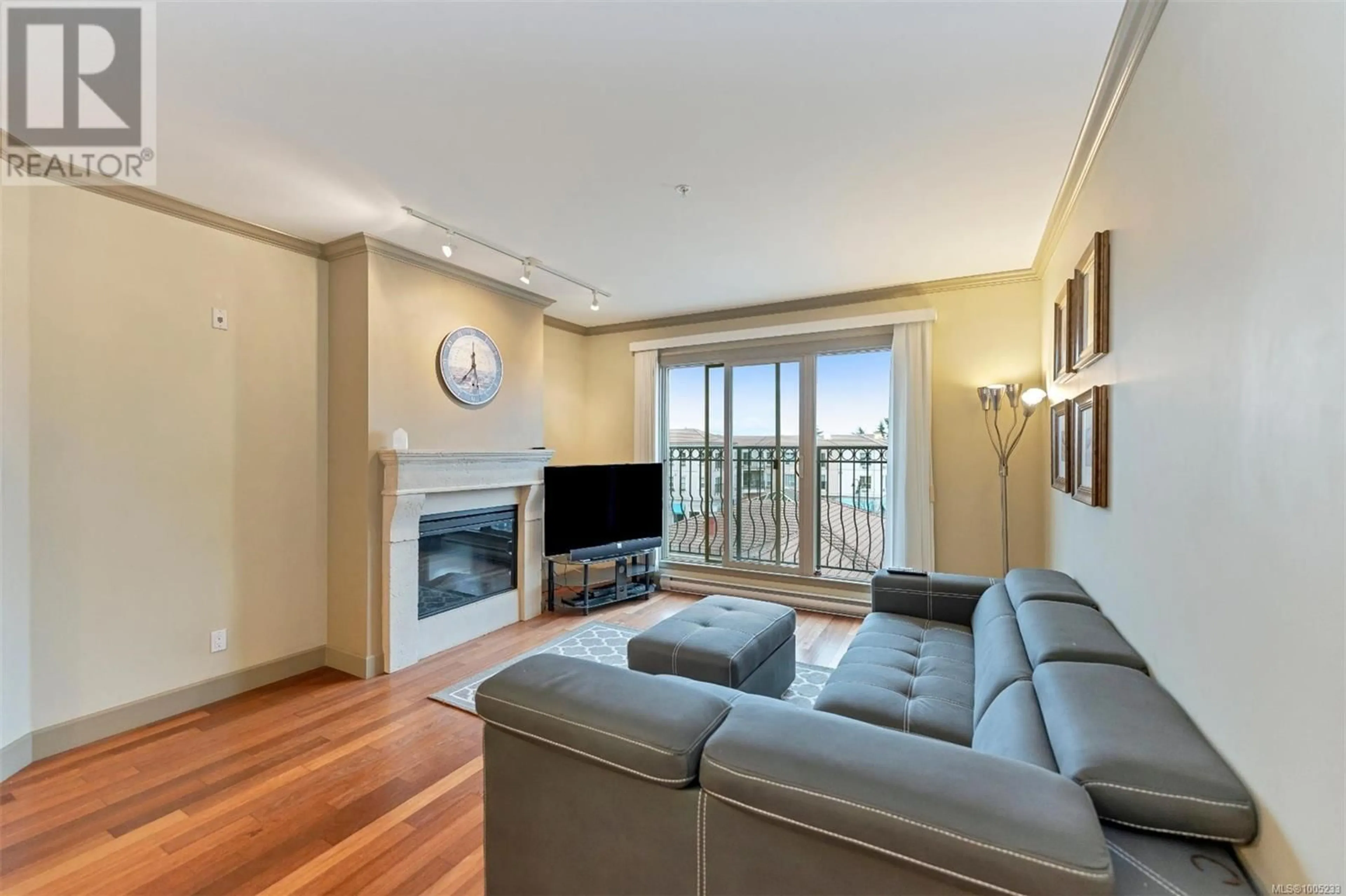 Living room with furniture, wood/laminate floor for 318 - 1620 MCKENZIE AVENUE, Saanich British Columbia V8N0A1