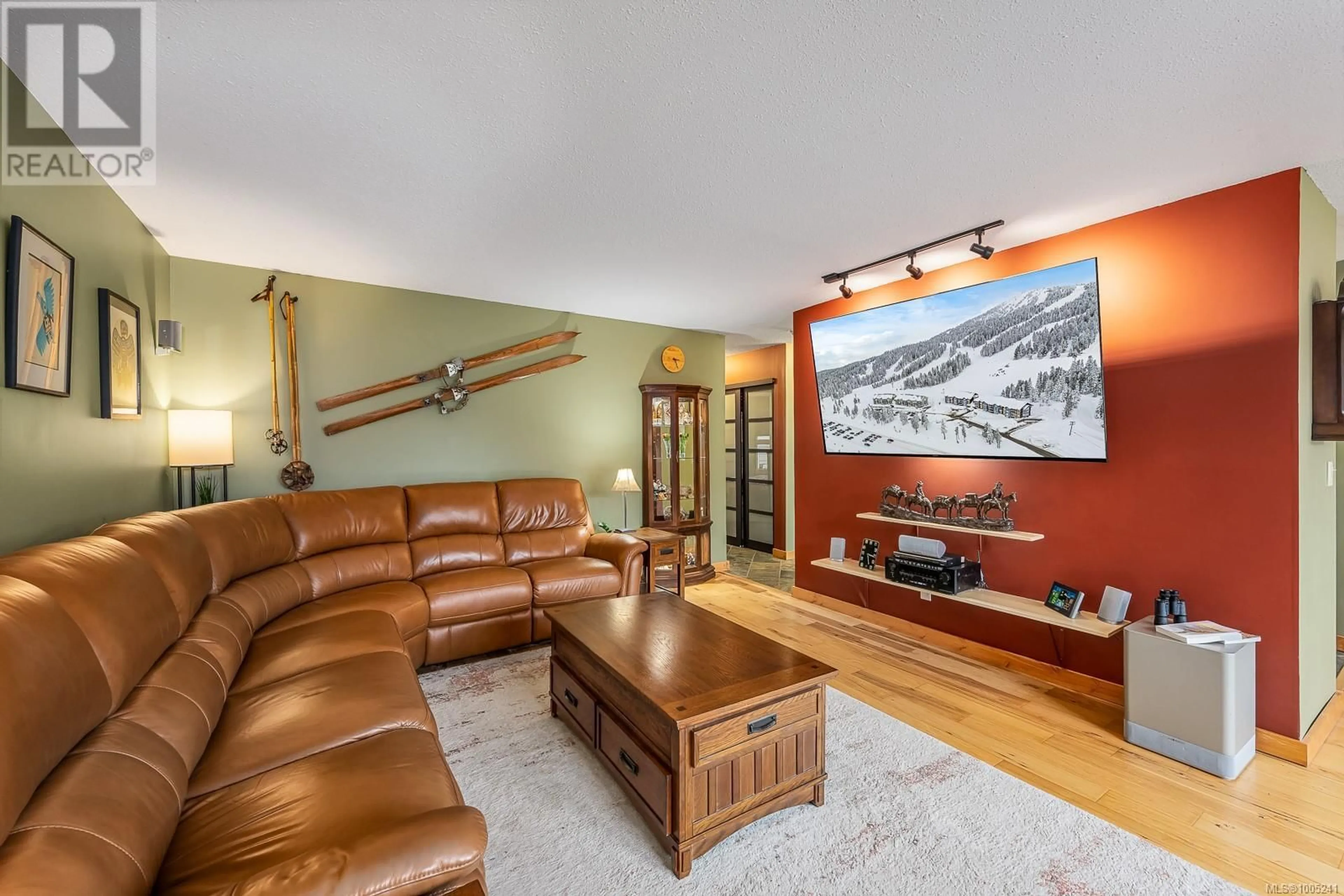 Living room with furniture, wood/laminate floor for 217 - 205 1ST STREET, Courtenay British Columbia V9N1A5