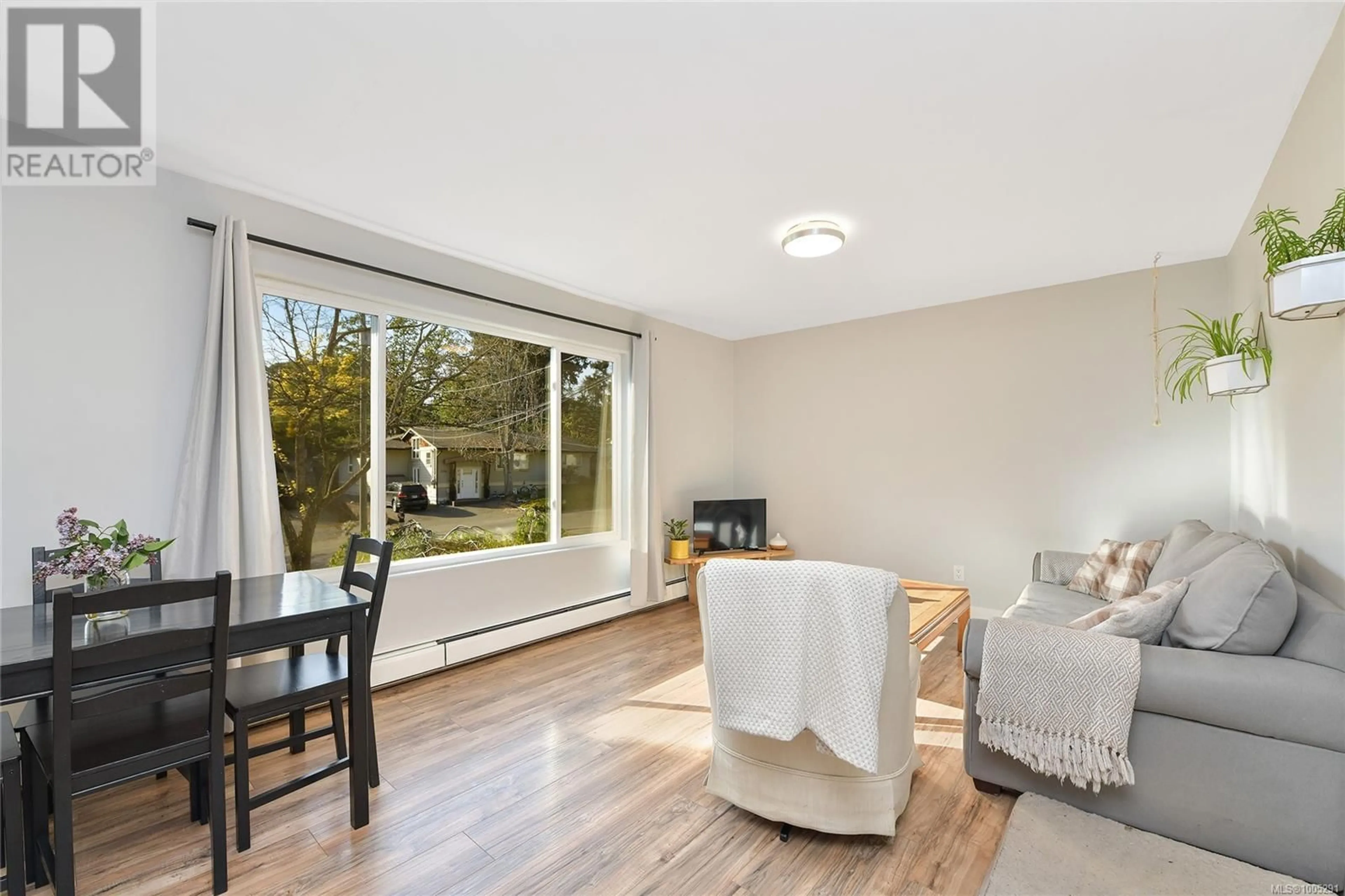 Living room with furniture, wood/laminate floor for 2589 WENTWICH ROAD, Langford British Columbia V9B3N5