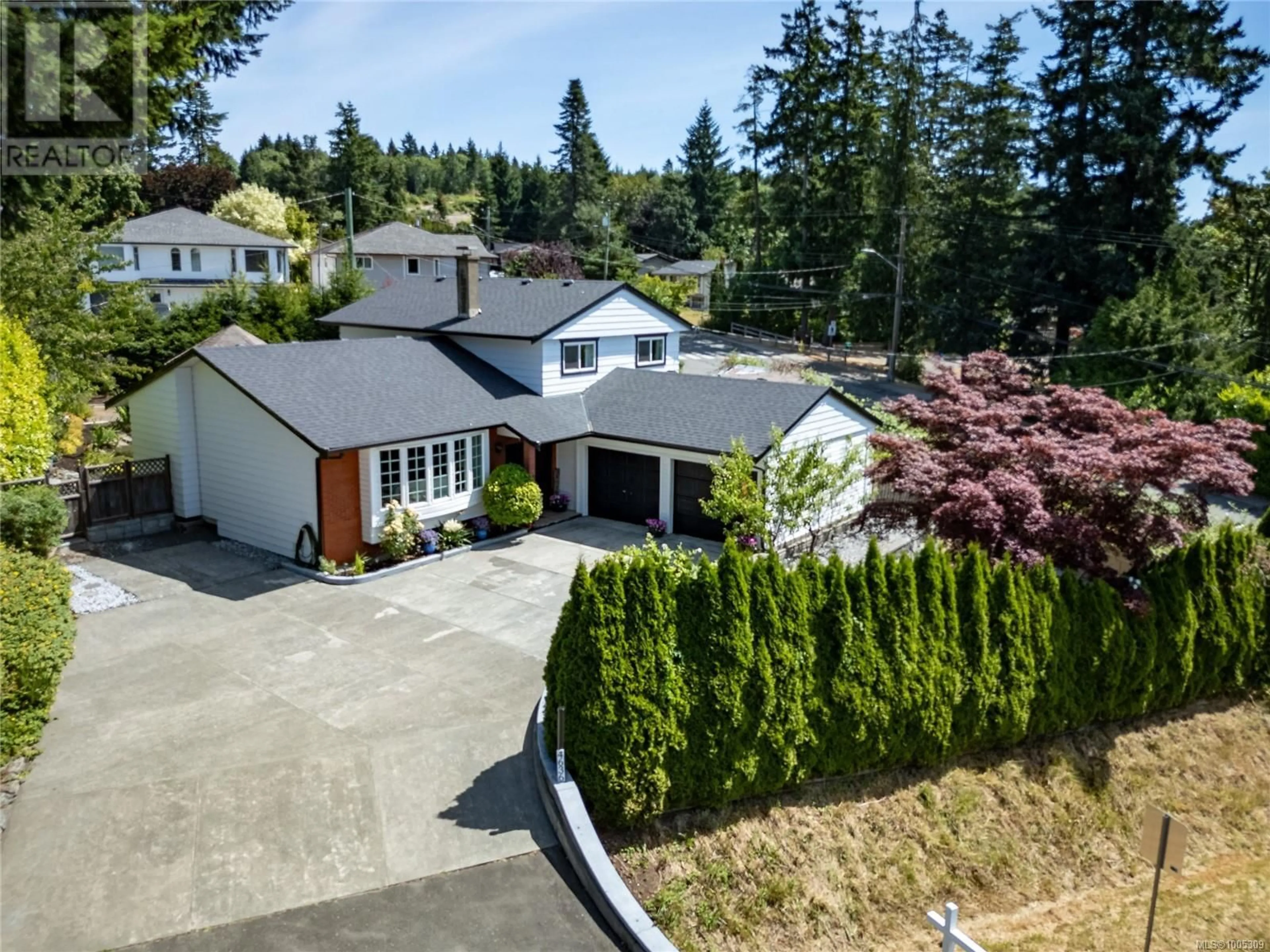 A pic from outside/outdoor area/front of a property/back of a property/a pic from drone, street for 4636 WESTERN ROAD, Courtenay British Columbia V9N3T2