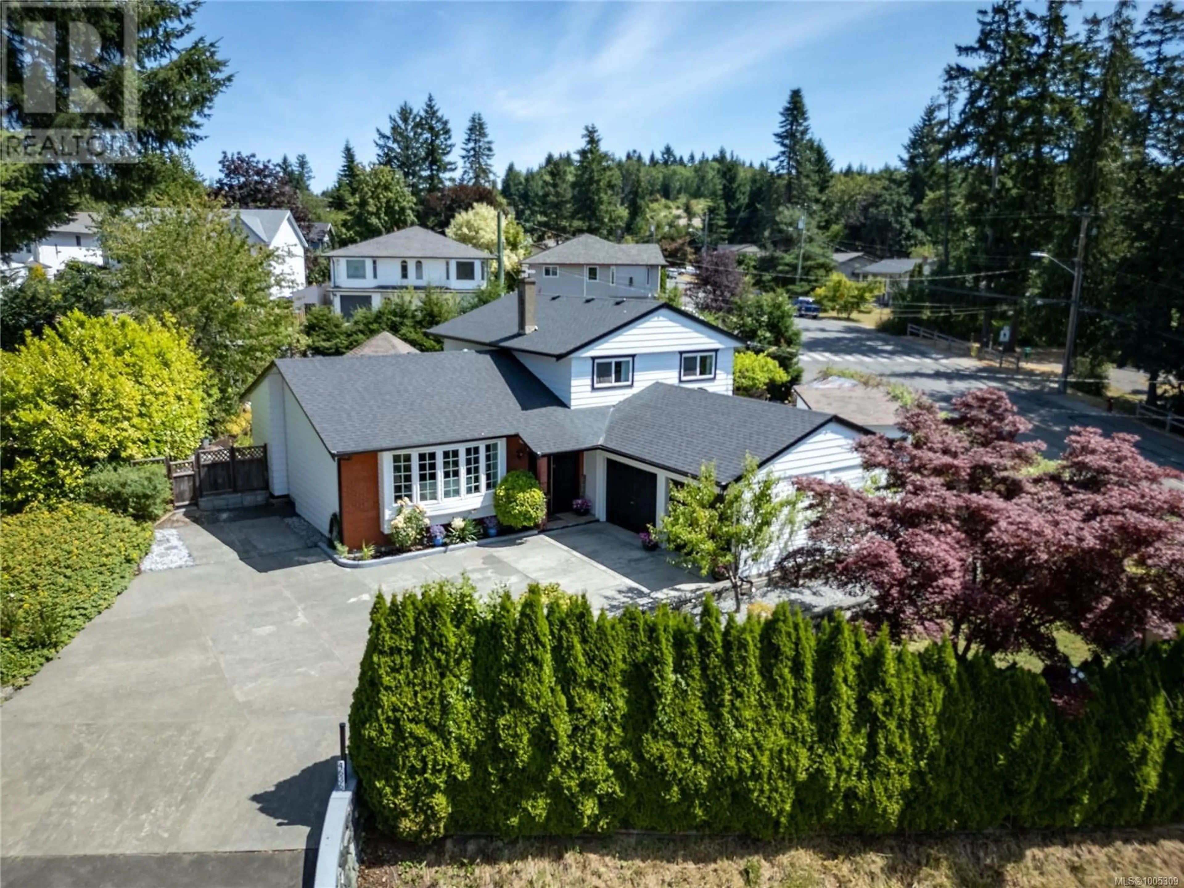 A pic from outside/outdoor area/front of a property/back of a property/a pic from drone, street for 4636 WESTERN ROAD, Courtenay British Columbia V9N3T2