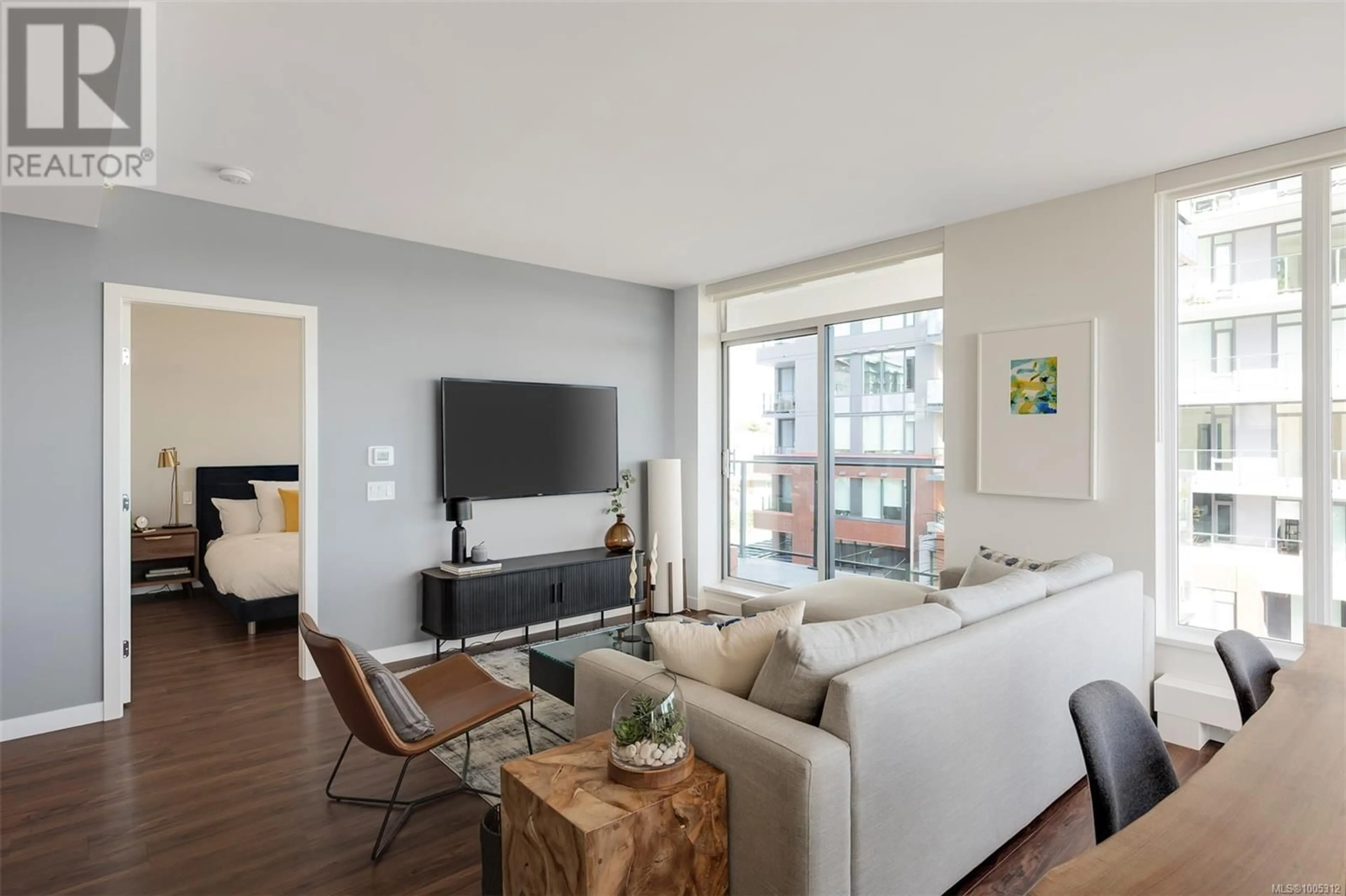 Living room with furniture, wood/laminate floor for 407 - 363 TYEE ROAD, Victoria British Columbia V9A0B5