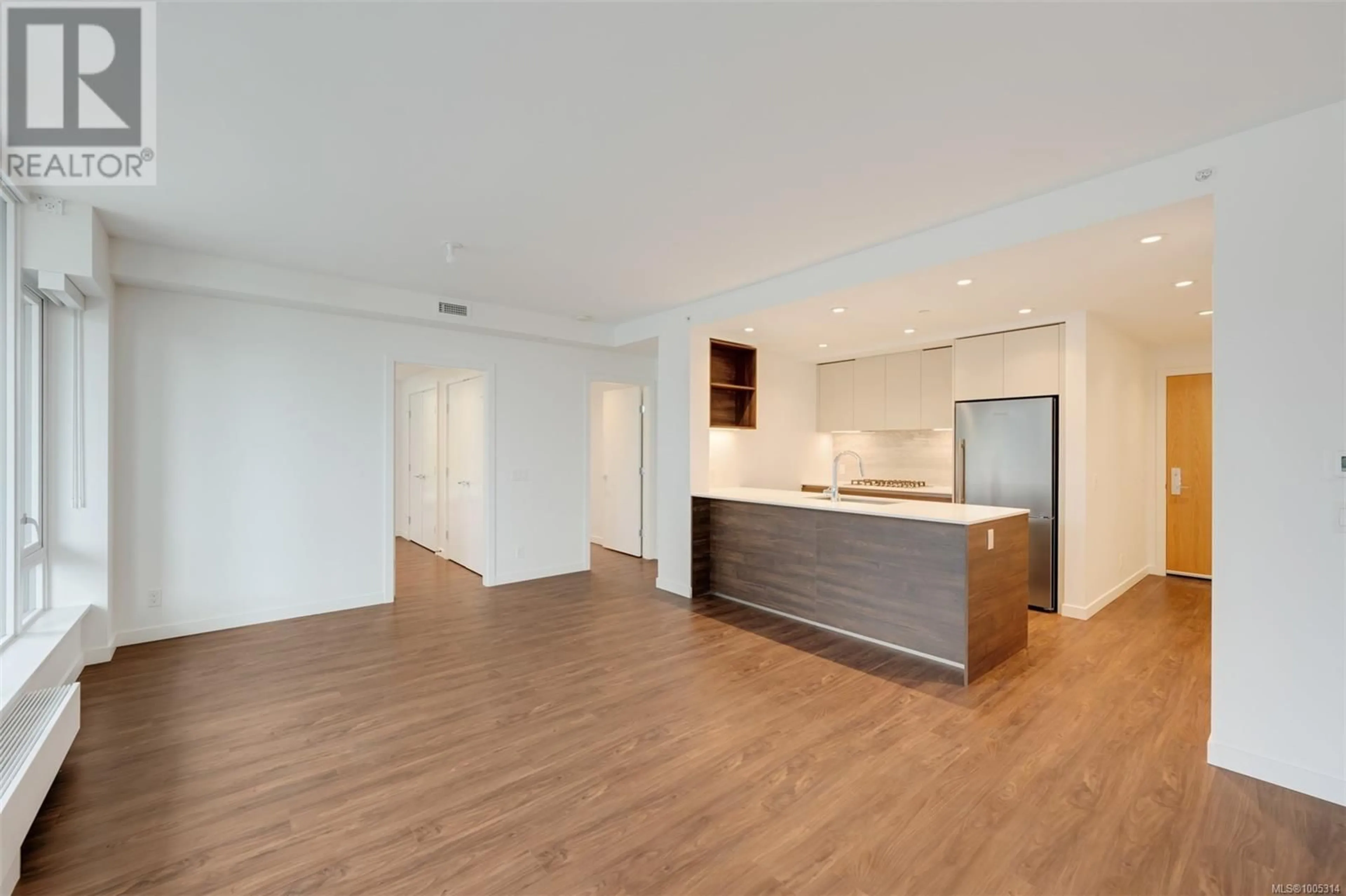 Open concept kitchen, wood/laminate floor for 202 - 363 TYEE ROAD, Victoria British Columbia V9A0B5