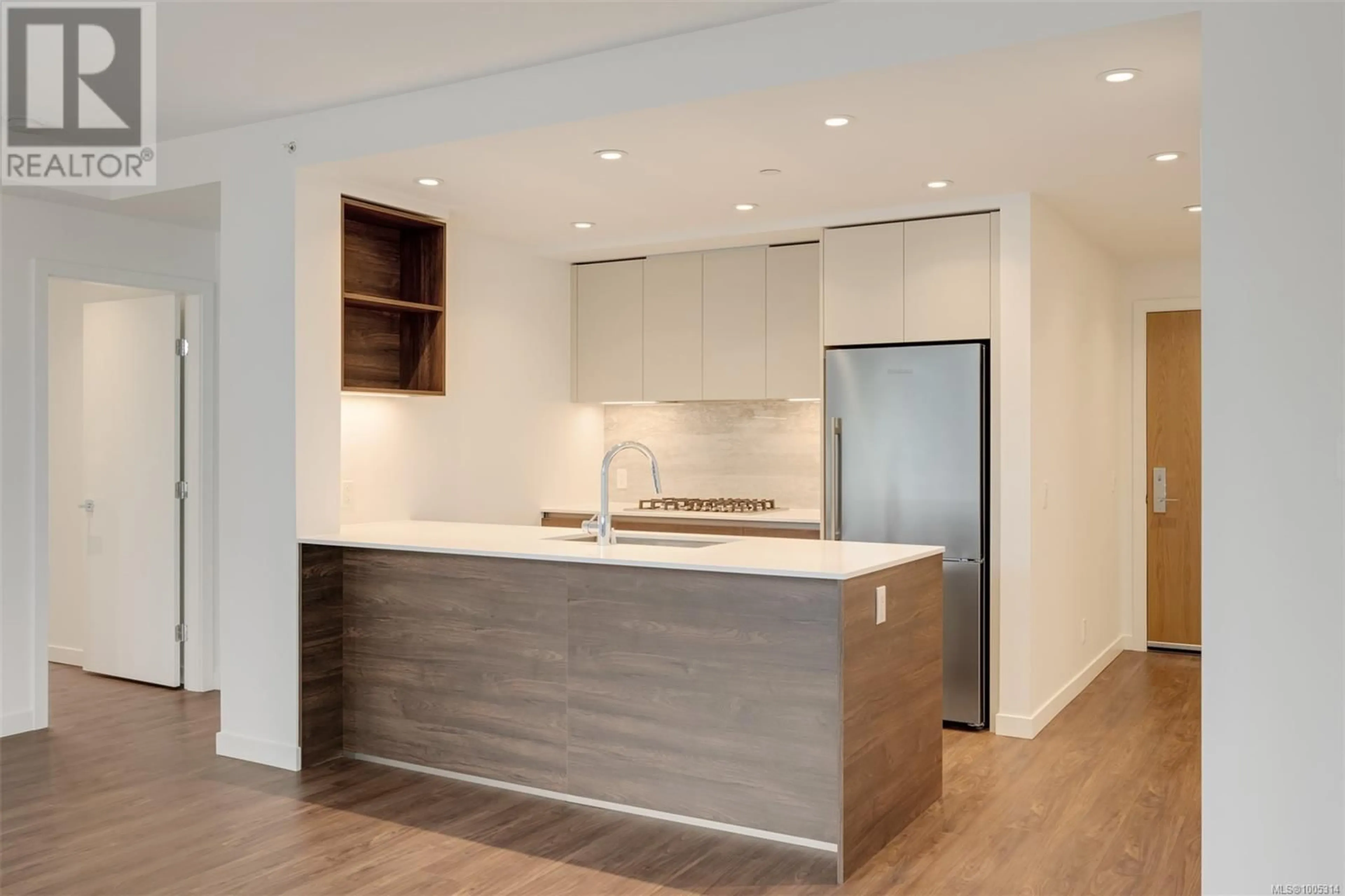 Open concept kitchen, wood/laminate floor for 202 - 363 TYEE ROAD, Victoria British Columbia V9A0B5