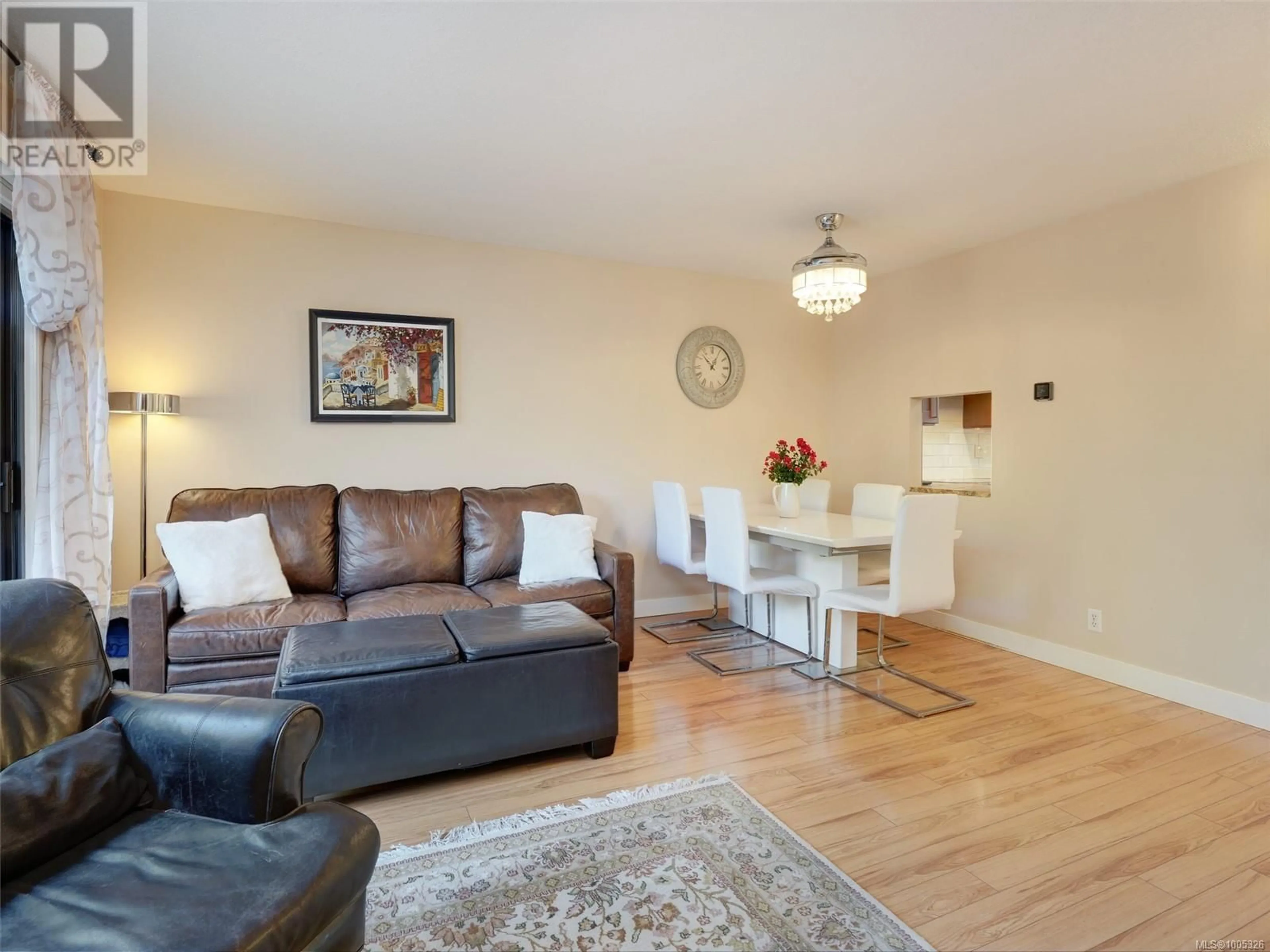 Living room with furniture, wood/laminate floor for 205 - 642 AGNES STREET, Saanich British Columbia V8Z2E6