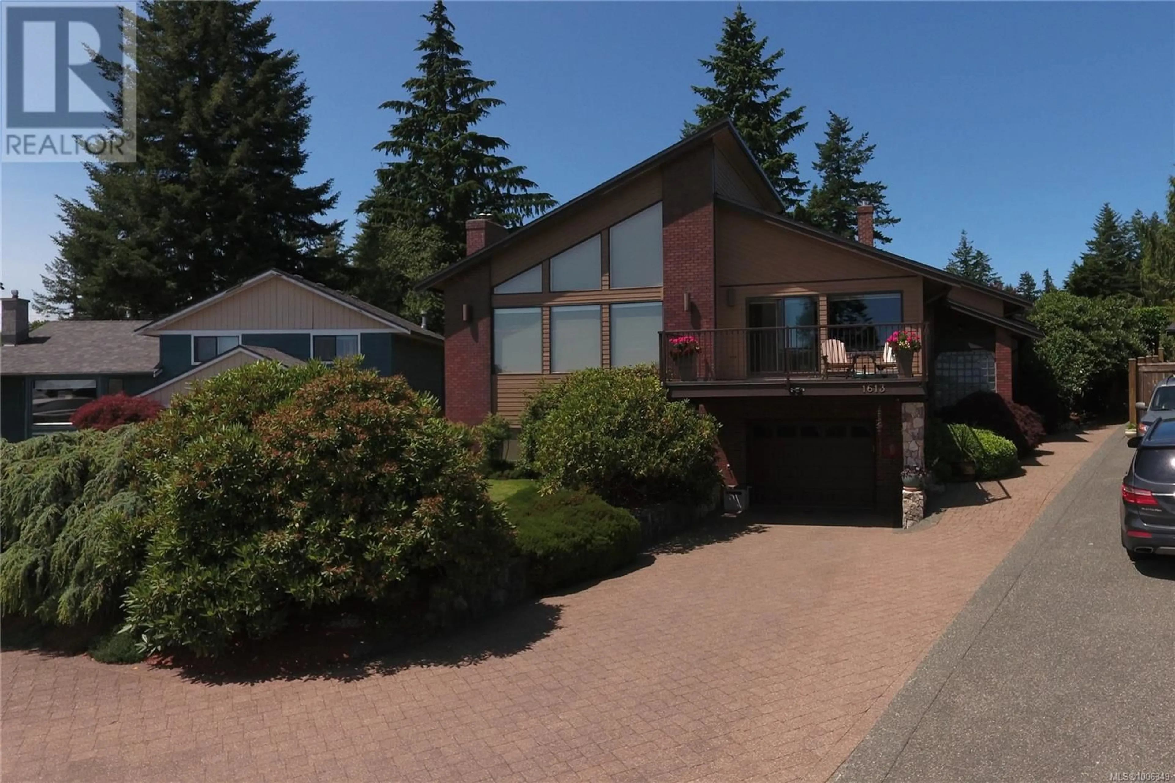 Home with vinyl exterior material, street for 1613 PASSAGE VIEW DRIVE, Campbell River British Columbia V9W6L2