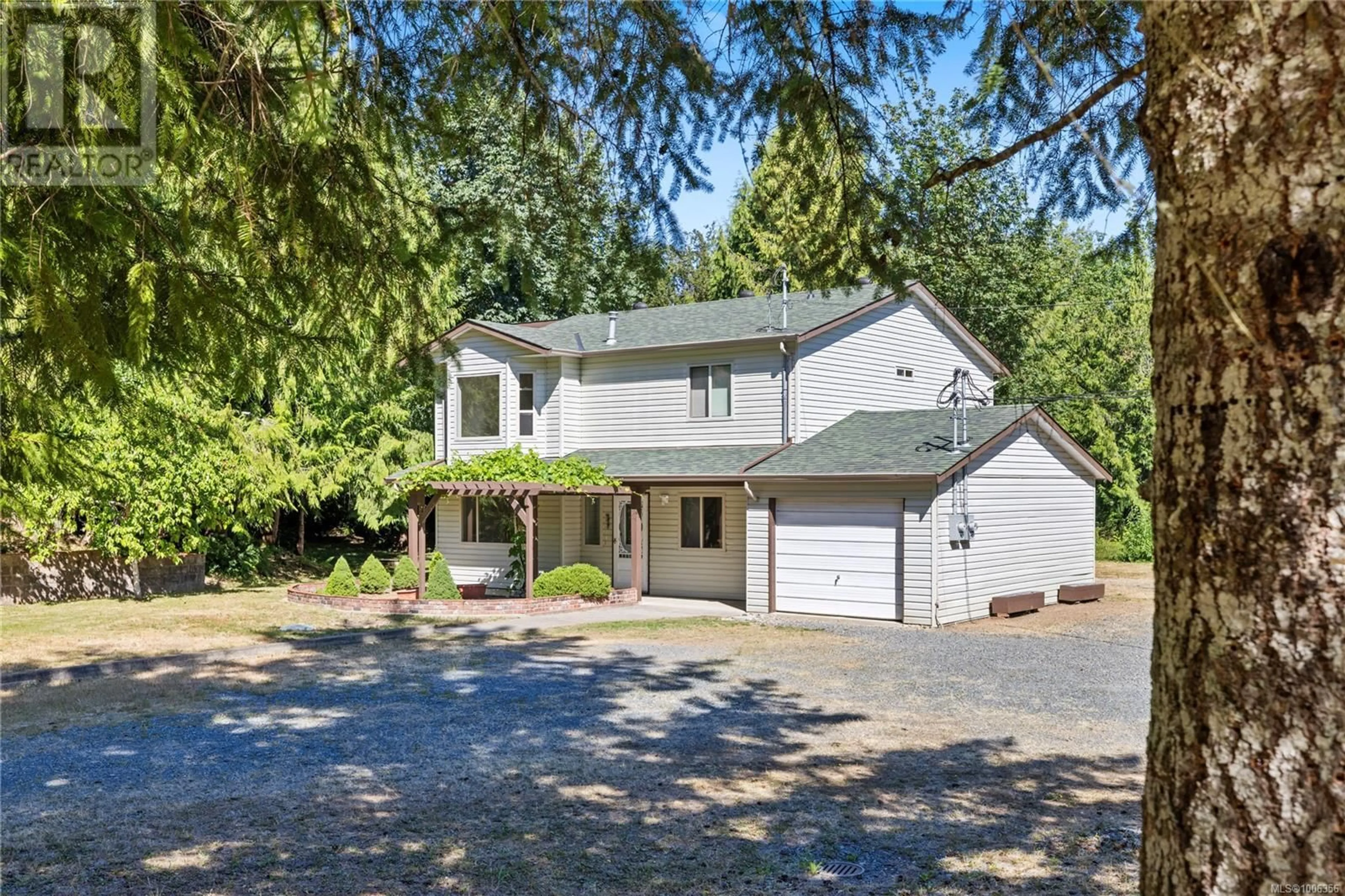 A pic from outside/outdoor area/front of a property/back of a property/a pic from drone, street for 1092 KOSKIMO ROAD, Qualicum Beach British Columbia V9K2R6