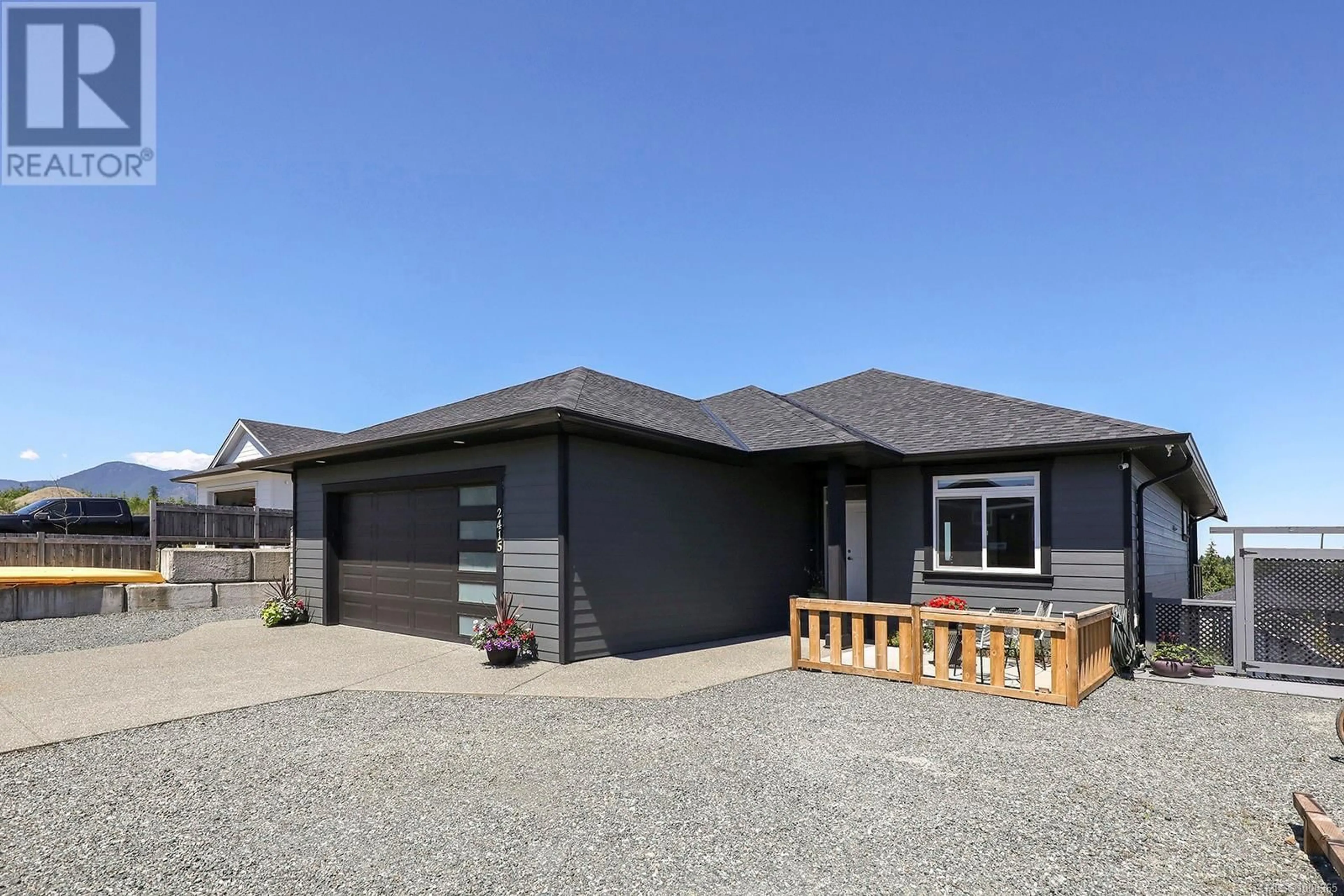 Home with vinyl exterior material, street for 2415 BEAUMONT CRESCENT, Cumberland British Columbia V0R1S0