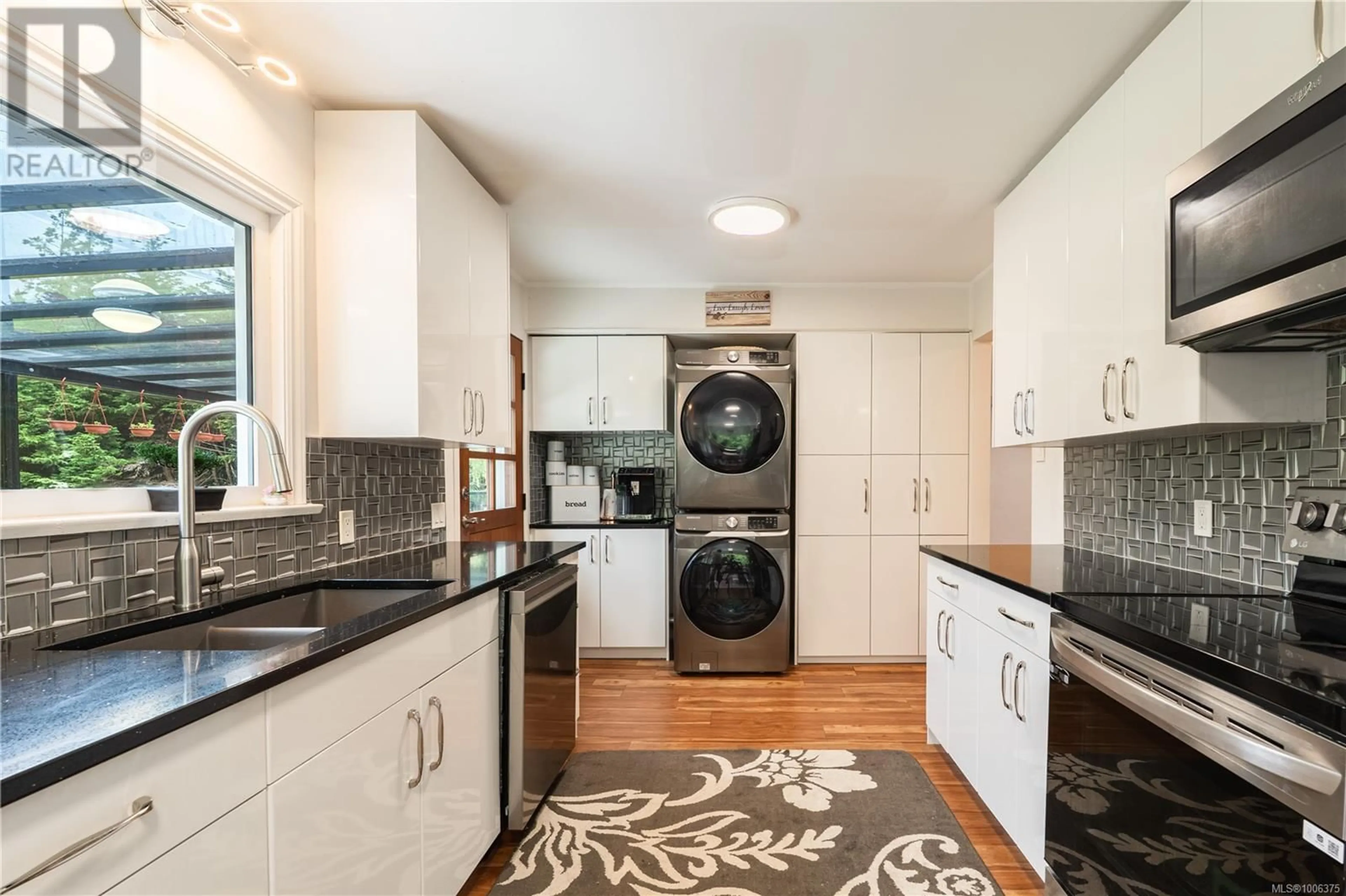 Kitchen with laundary machines, ceramic/tile floor for 575 LOWER GANGES ROAD, Salt Spring British Columbia V8K2N7