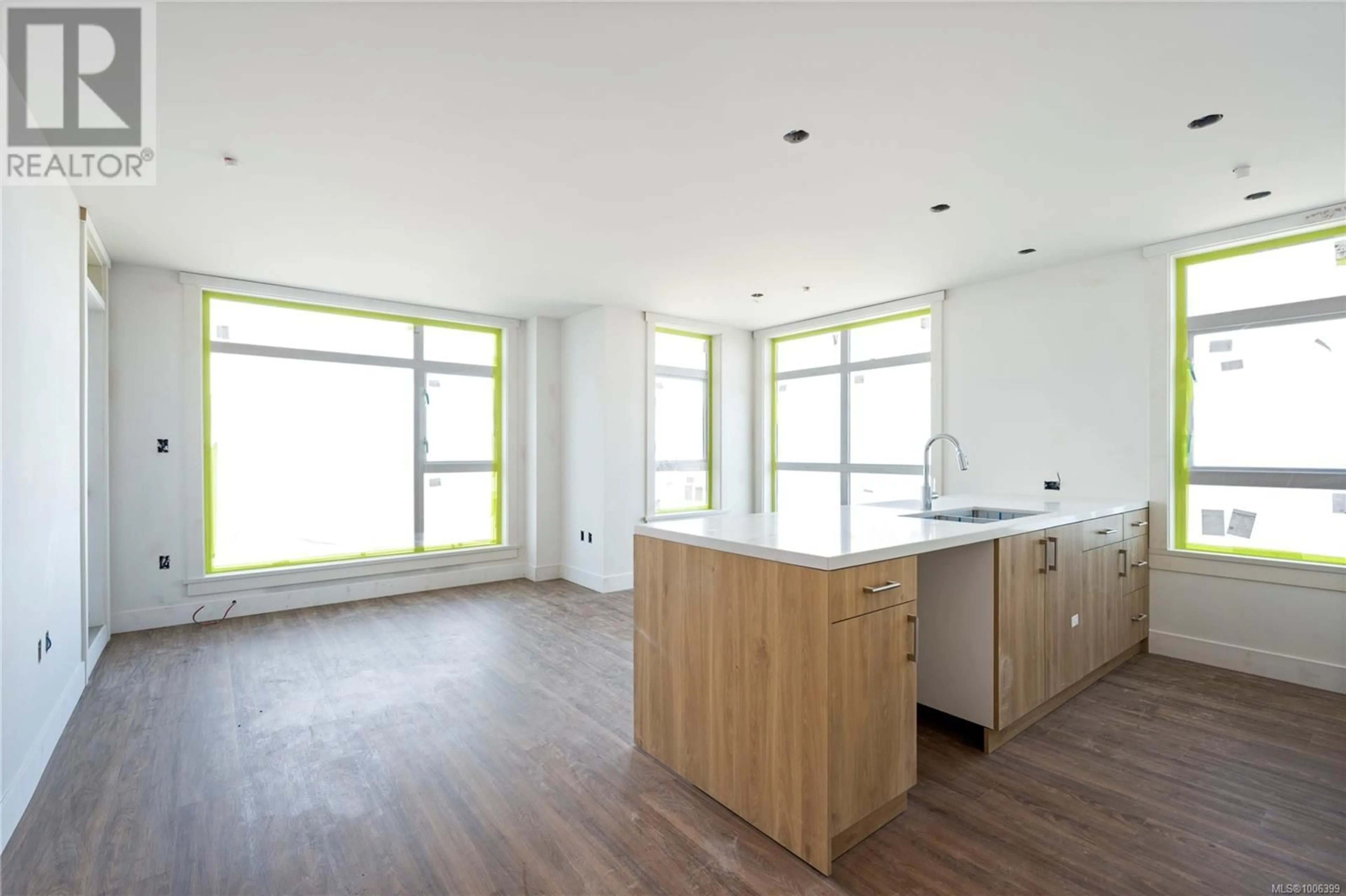 Open concept kitchen, wood/laminate floor for 103 - 6320 SENTINAL DRIVE, Nanaimo British Columbia V9V1W4
