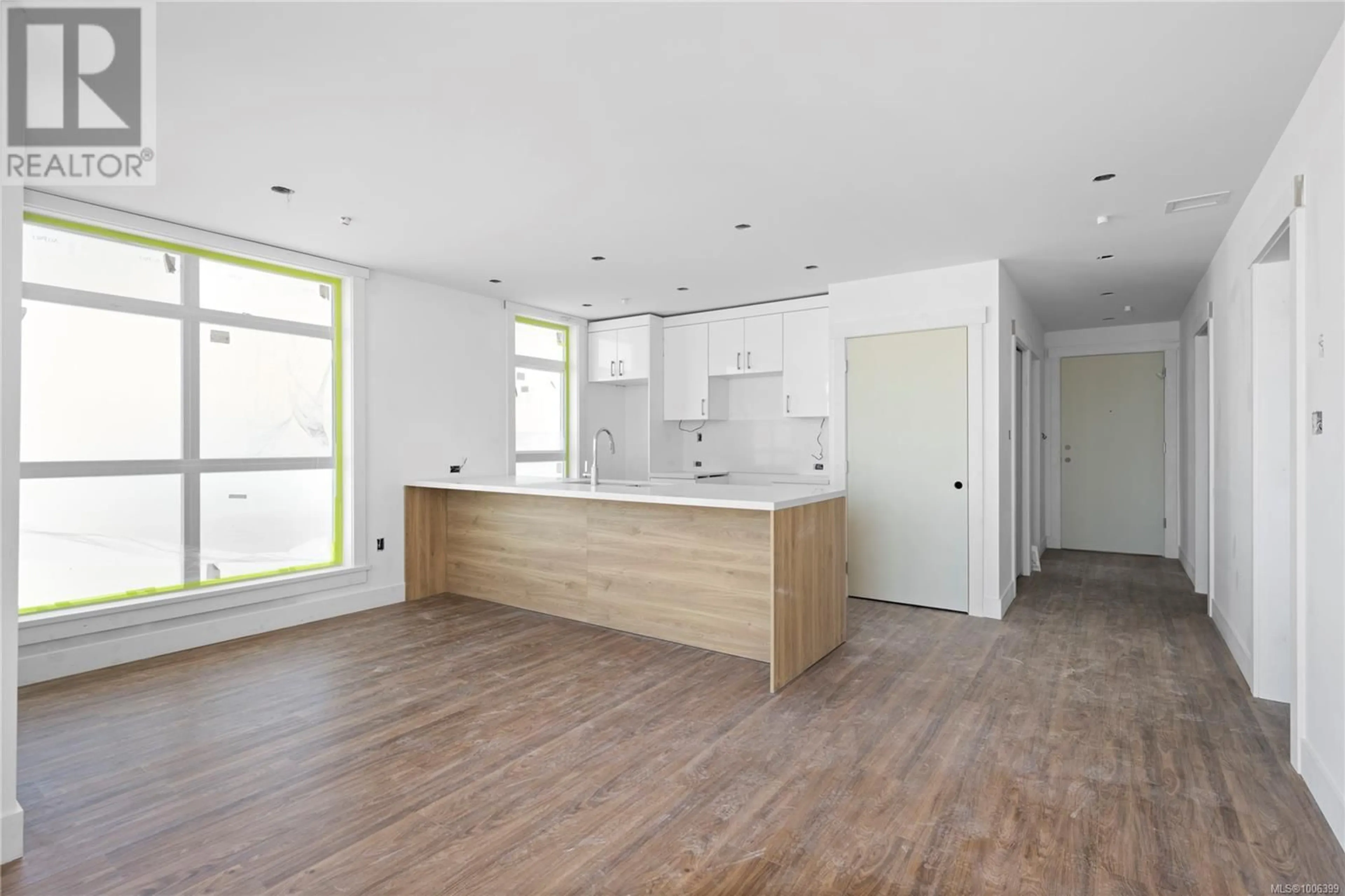 Open concept kitchen, wood/laminate floor for 103 - 6320 SENTINAL DRIVE, Nanaimo British Columbia V9V1W4