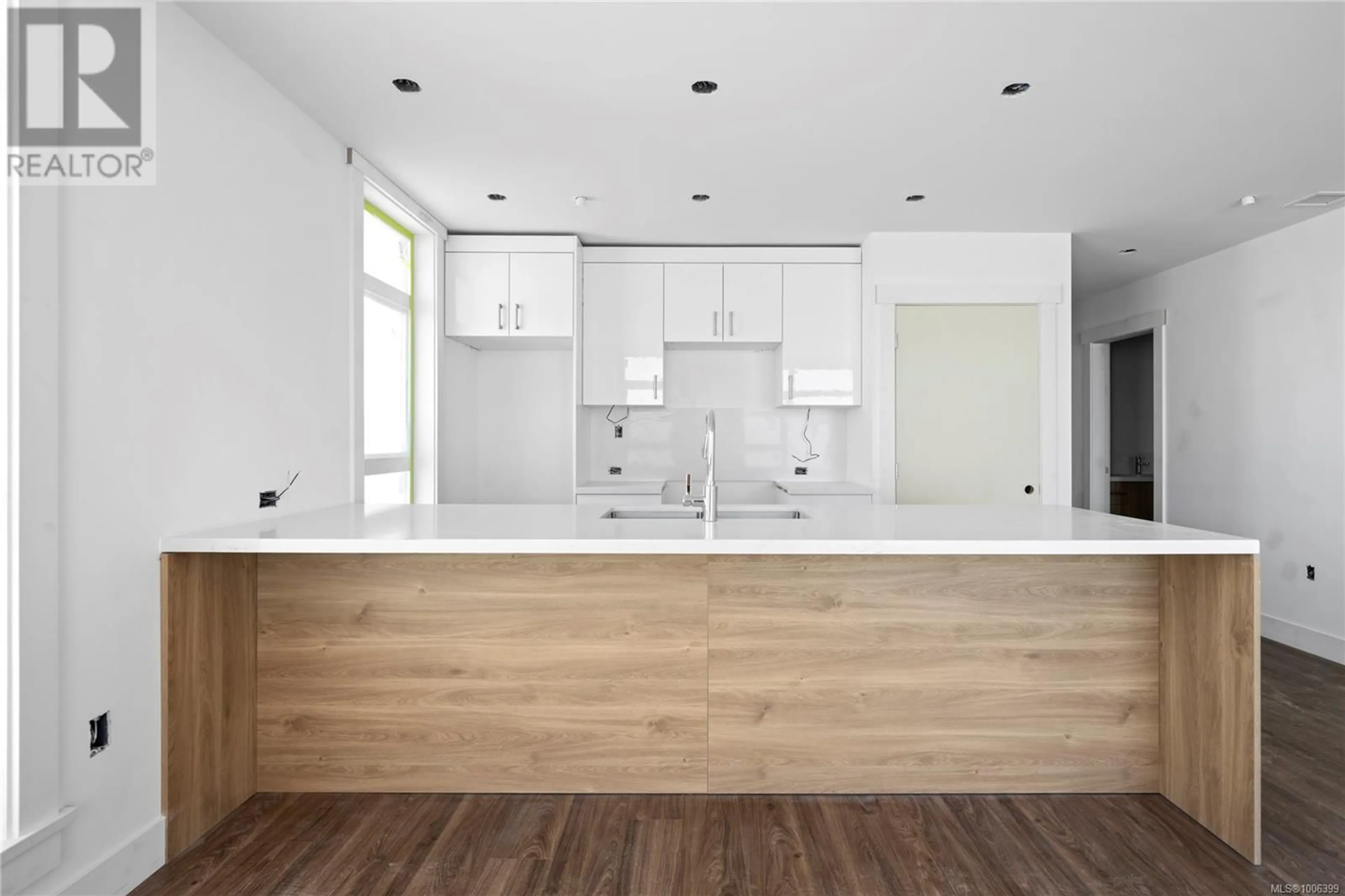 Open concept kitchen, wood/laminate floor for 103 - 6320 SENTINAL DRIVE, Nanaimo British Columbia V9V1W4