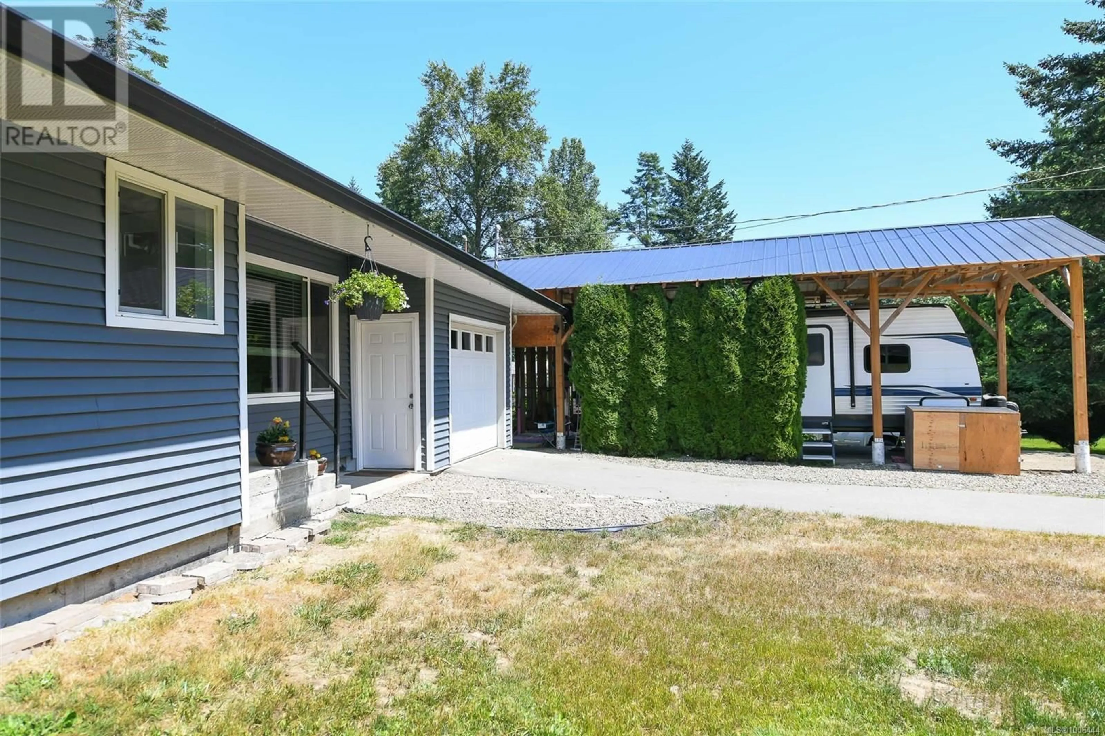Home with vinyl exterior material, street for 7452 COUGAR SMITH ROAD, Fanny Bay British Columbia V0R1W0