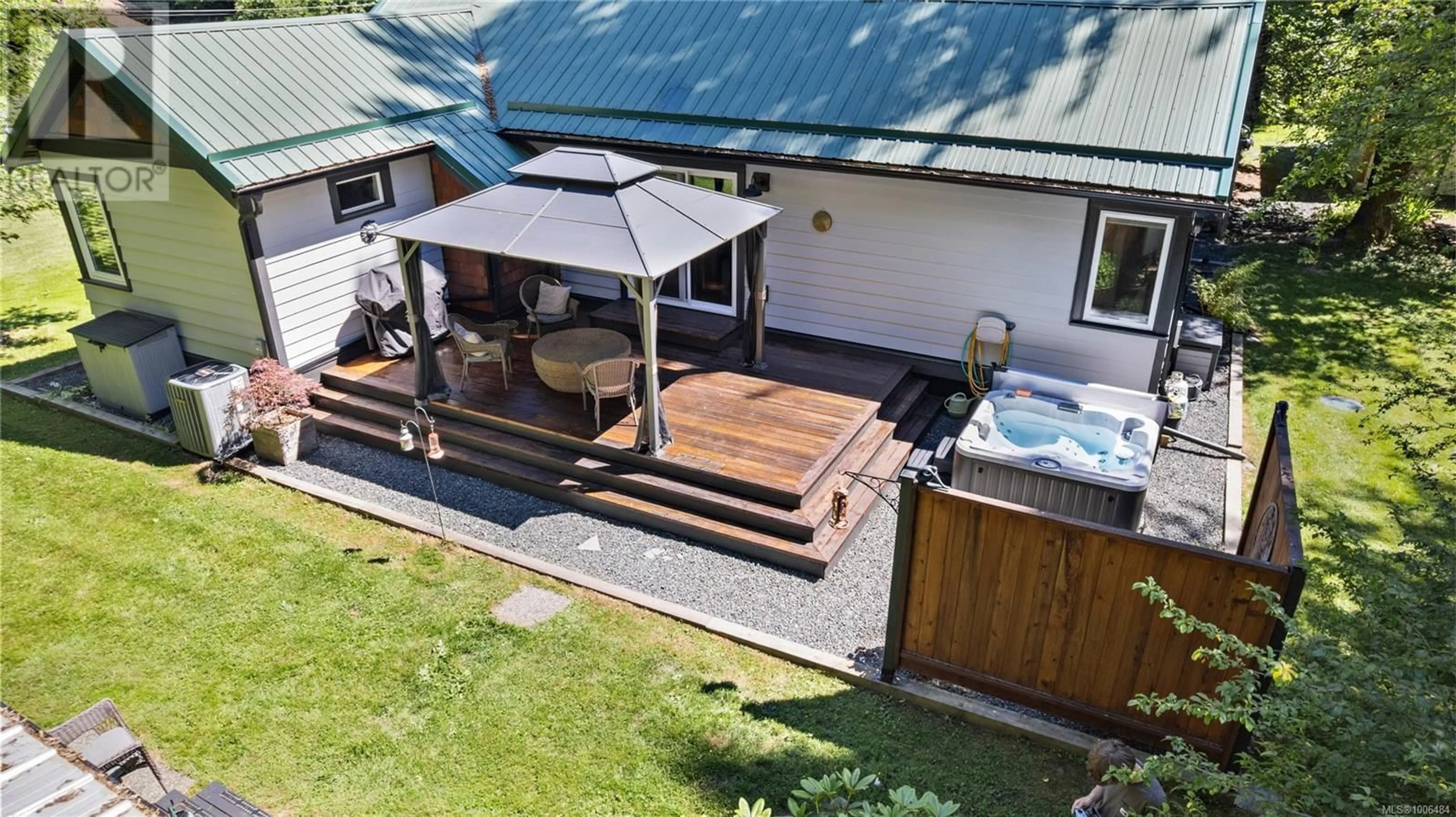 A pic from outside/outdoor area/front of a property/back of a property/a pic from drone, street for 9490 SOUTH SHORE ROAD, Honeymoon Bay British Columbia V0R3E3