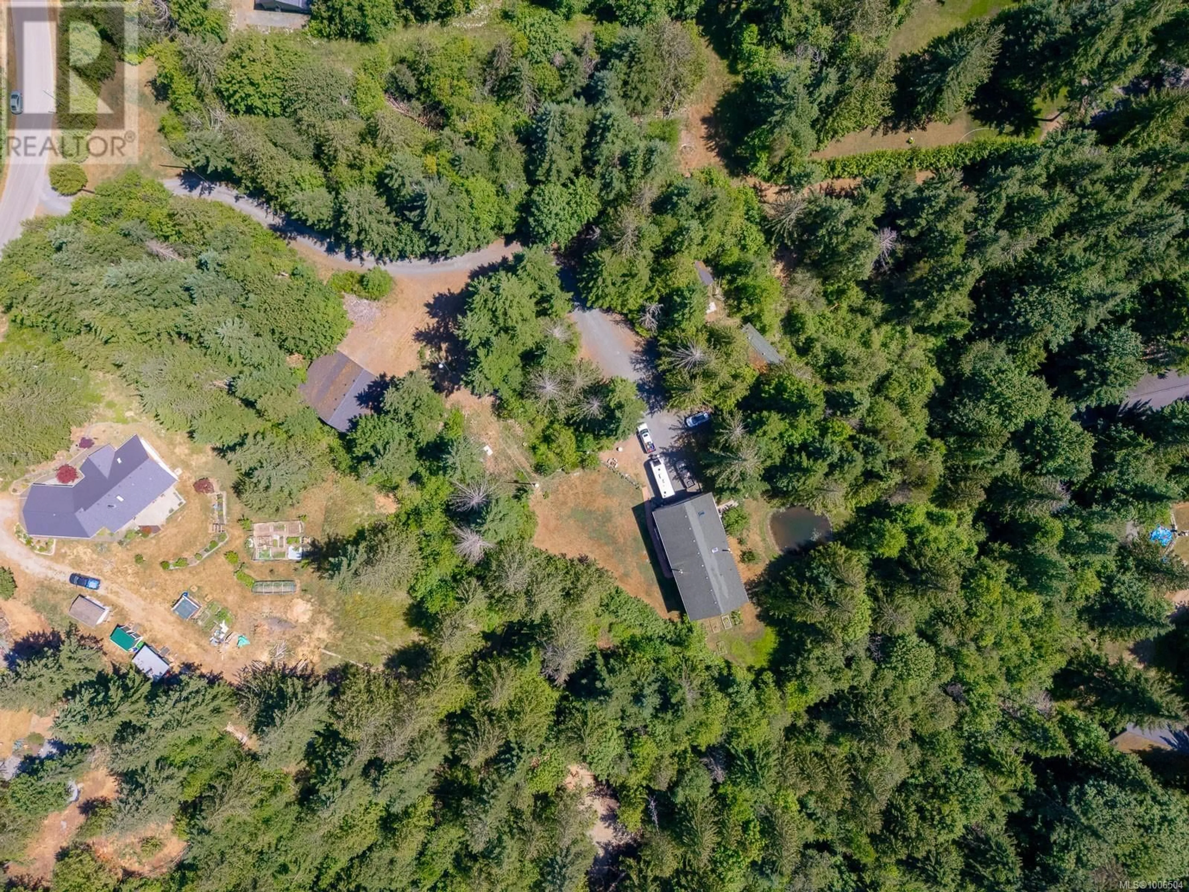 A pic from outside/outdoor area/front of a property/back of a property/a pic from drone, forest/trees view for 1890 PIERCE WAY, Qualicum Beach British Columbia V9K2V1