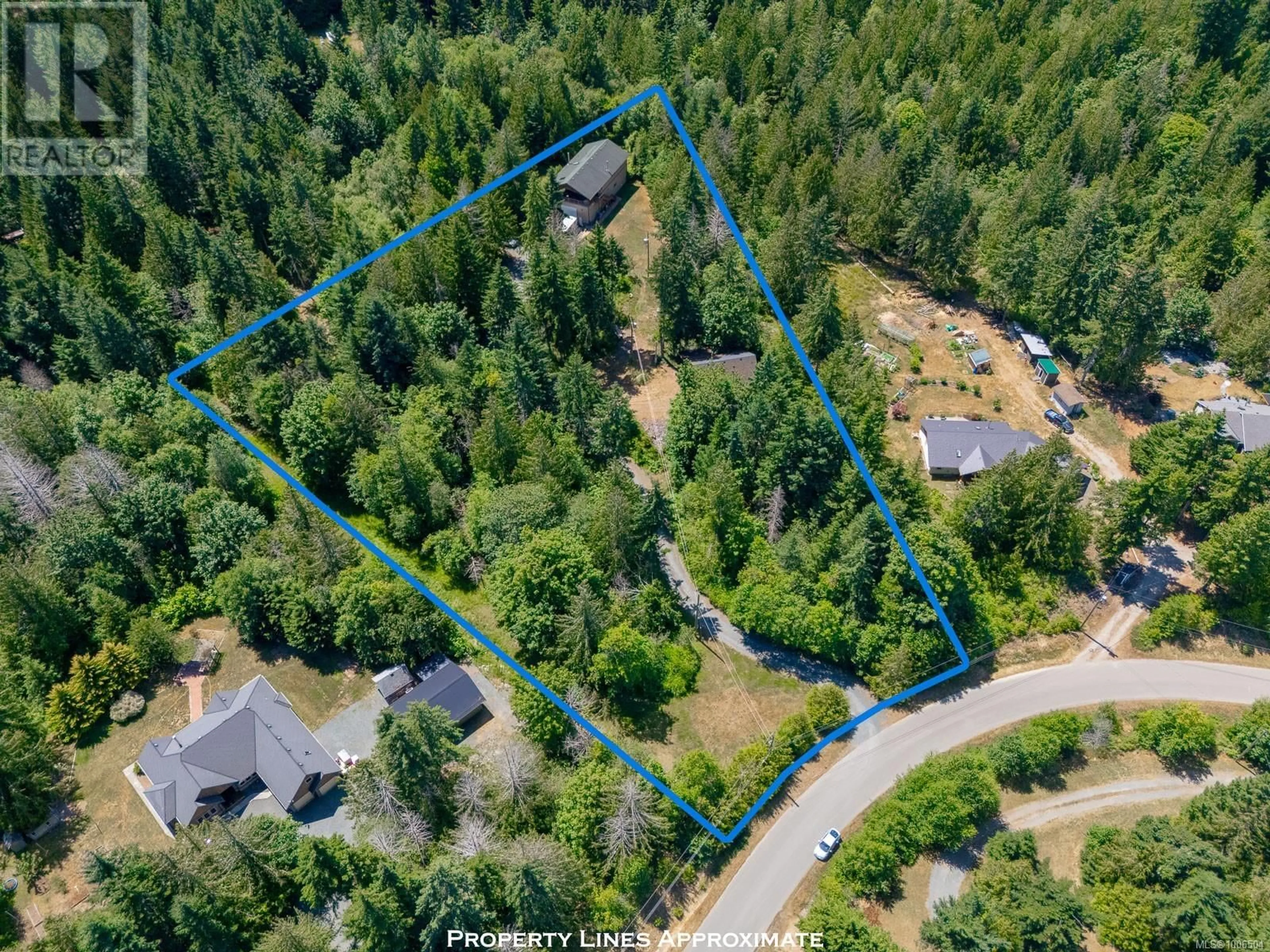 A pic from outside/outdoor area/front of a property/back of a property/a pic from drone, forest/trees view for 1890 PIERCE WAY, Qualicum Beach British Columbia V9K2V1
