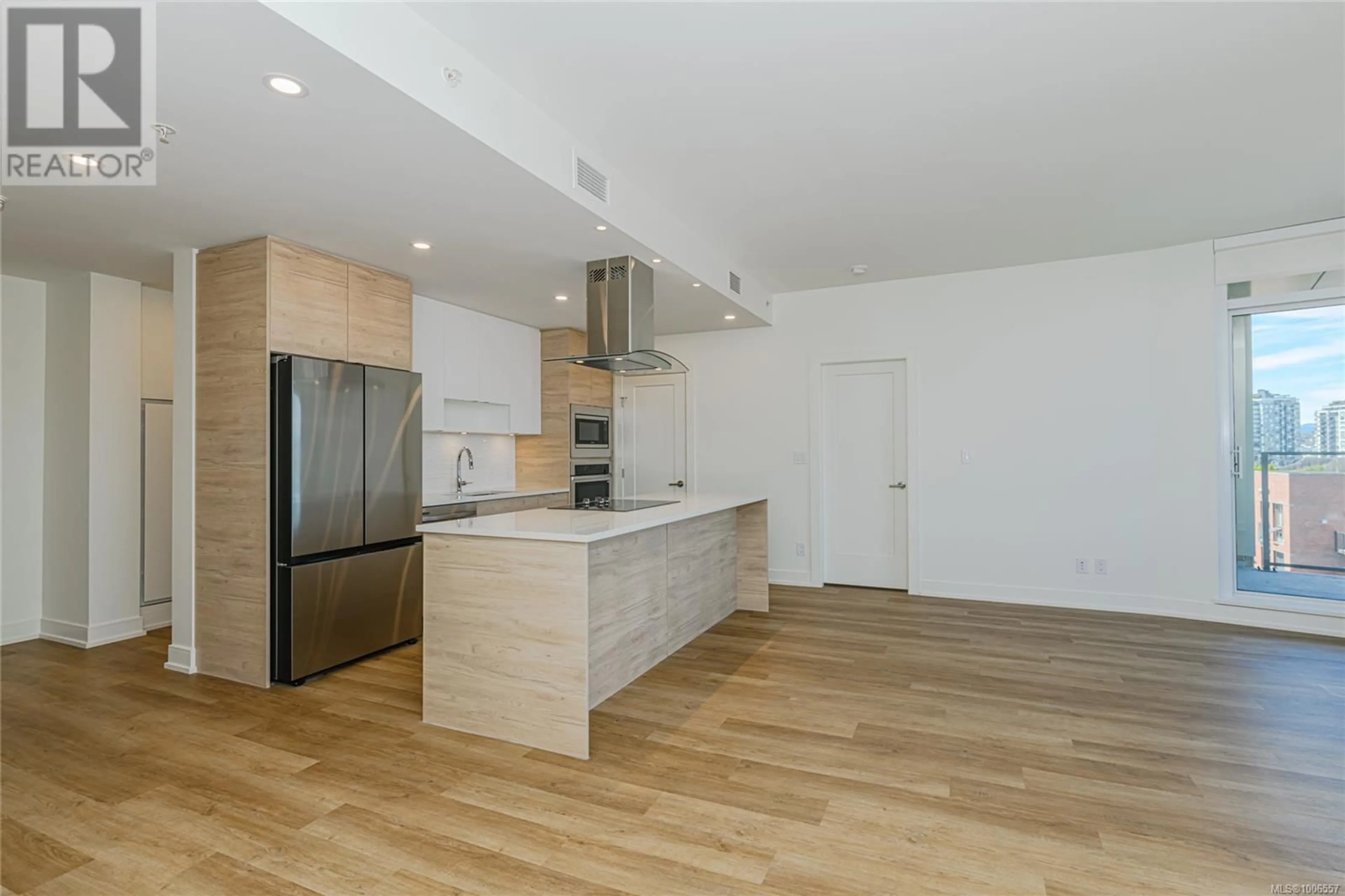 Open concept kitchen, wood/laminate floor for 903 - 1628 STORE STREET, Victoria British Columbia V8W0H1