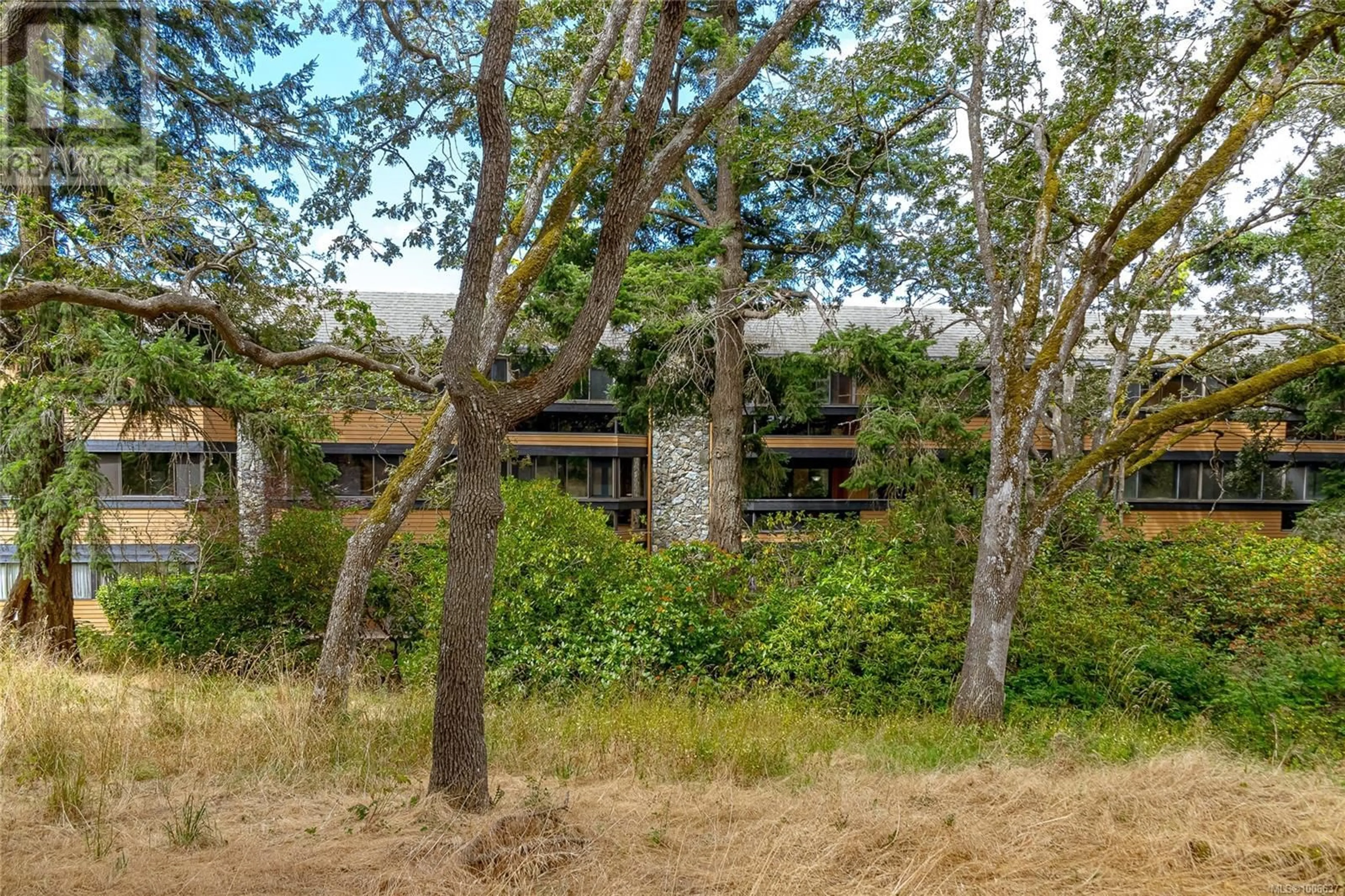 A pic from outside/outdoor area/front of a property/back of a property/a pic from drone, forest/trees view for 304 - 1106 GLENORA PLACE, Saanich British Columbia V8P2C3