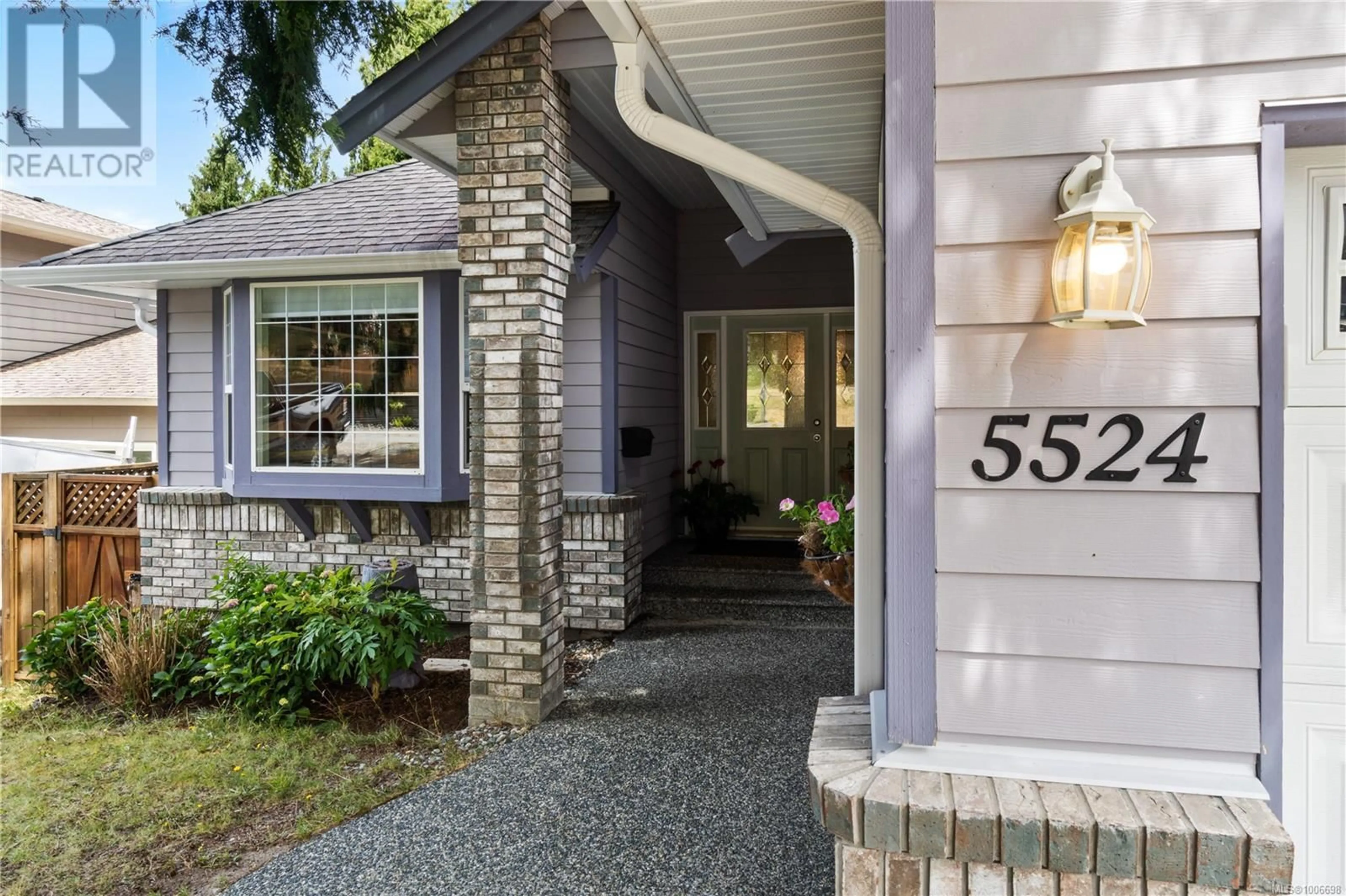 Home with brick exterior material, street for 5524 AVRO WAY, Nanaimo British Columbia V9T4Z3