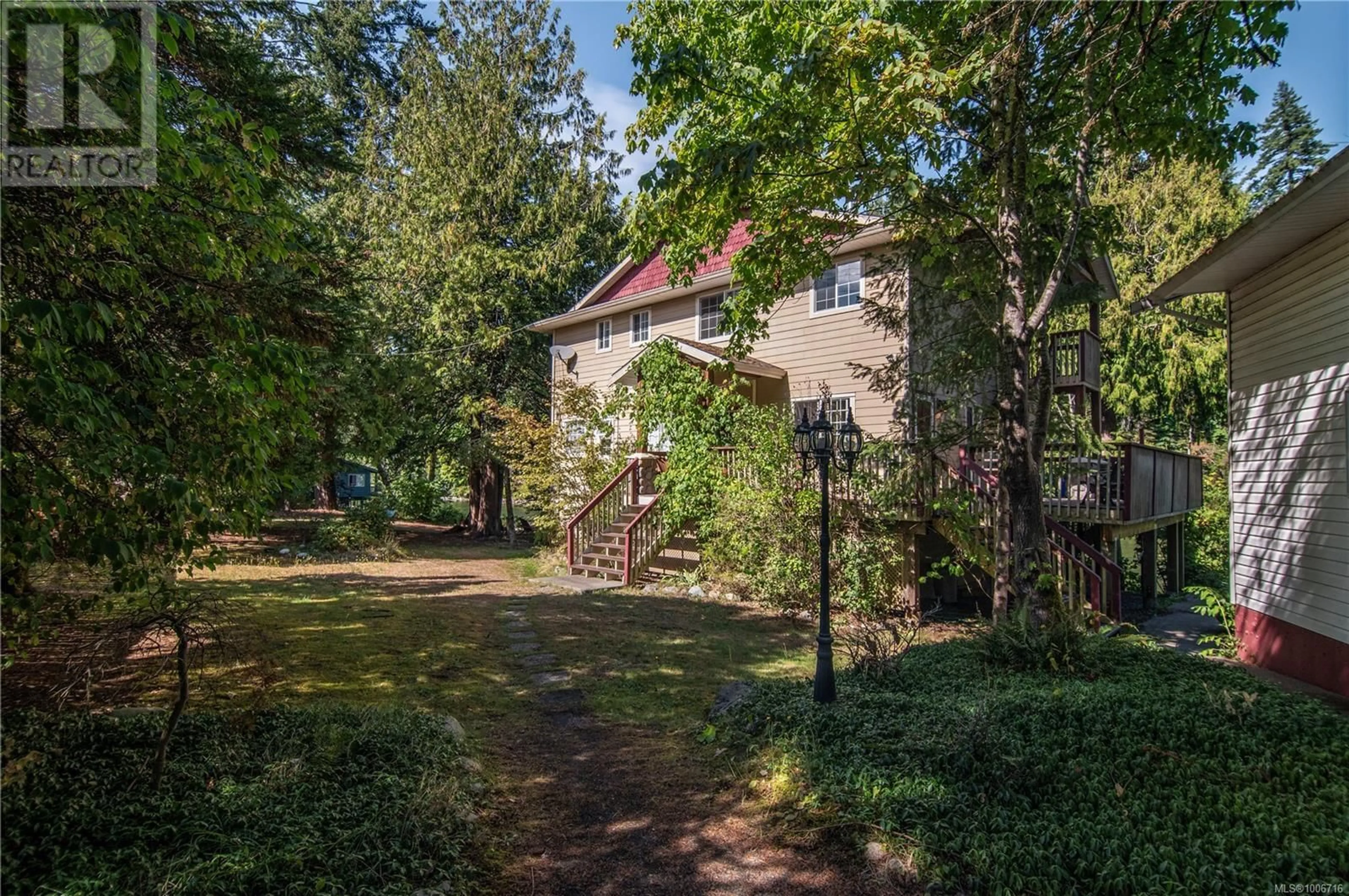 A pic from outside/outdoor area/front of a property/back of a property/a pic from drone, street for 2420 CAMPBELL RIVER ROAD, Campbell River British Columbia V9W4N7