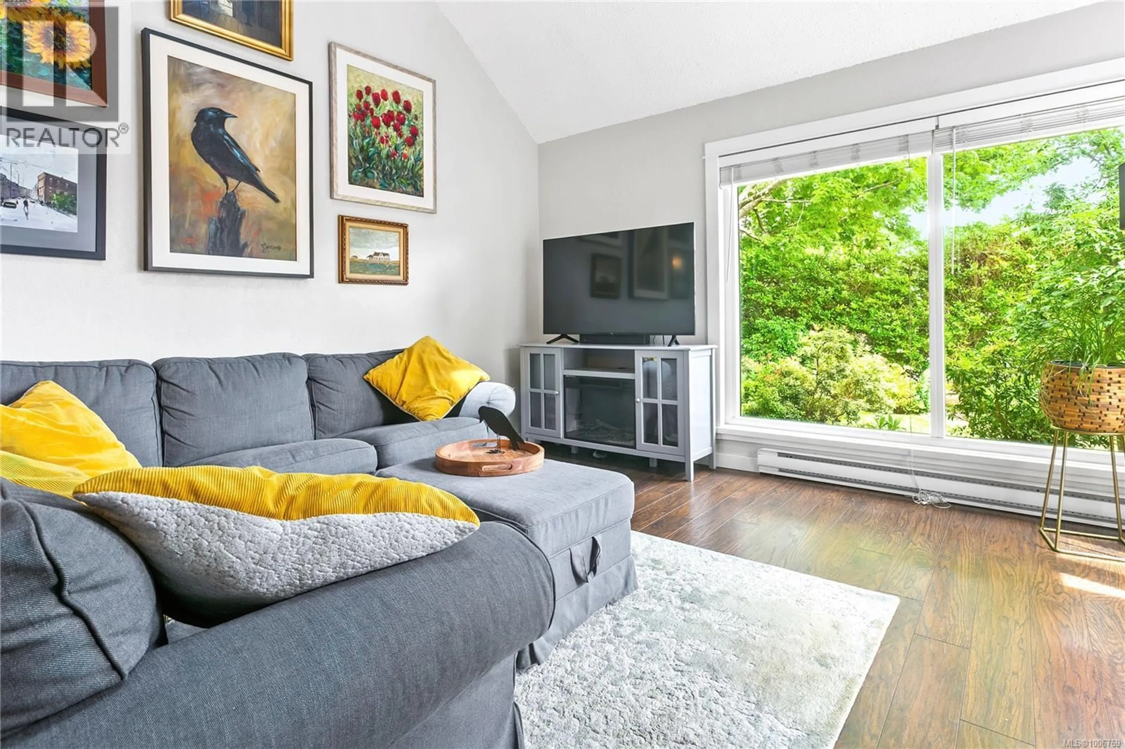 Living room with furniture, wood/laminate floor for 2308 FERNWOOD ROAD, Victoria British Columbia V8T2Z5