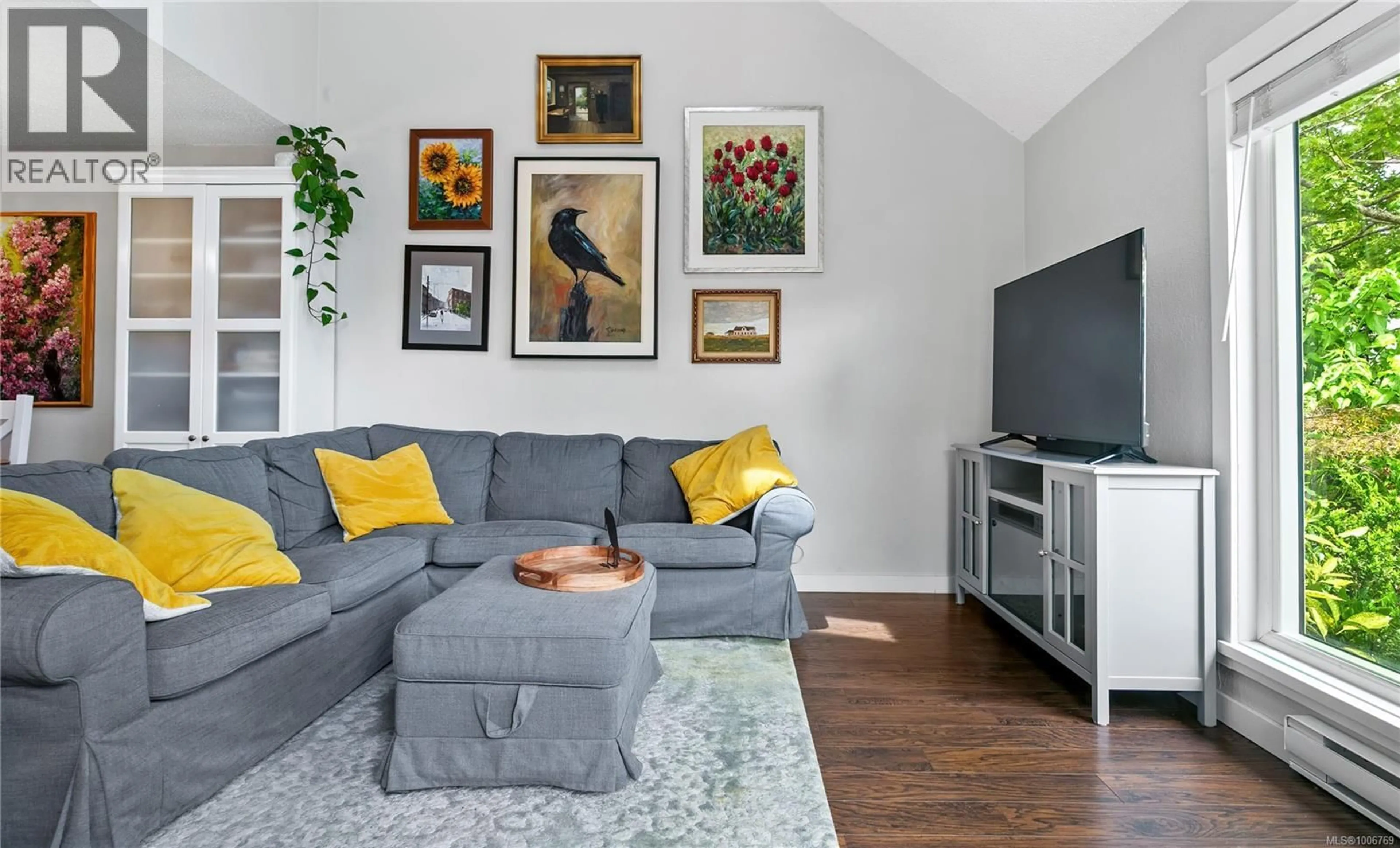 Living room with furniture, wood/laminate floor for 2308 FERNWOOD ROAD, Victoria British Columbia V8T2Z5