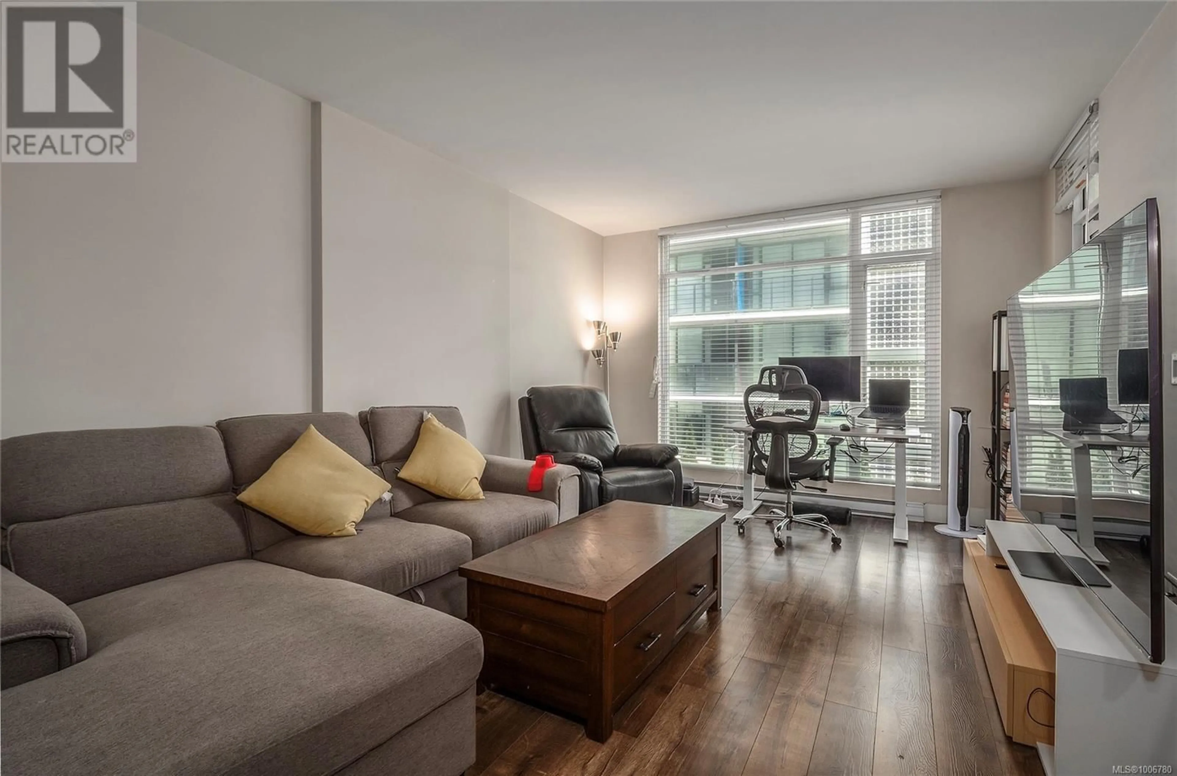 Living room with furniture, wood/laminate floor for 408 - 1090 JOHNSON STREET, Victoria British Columbia V8V3P6