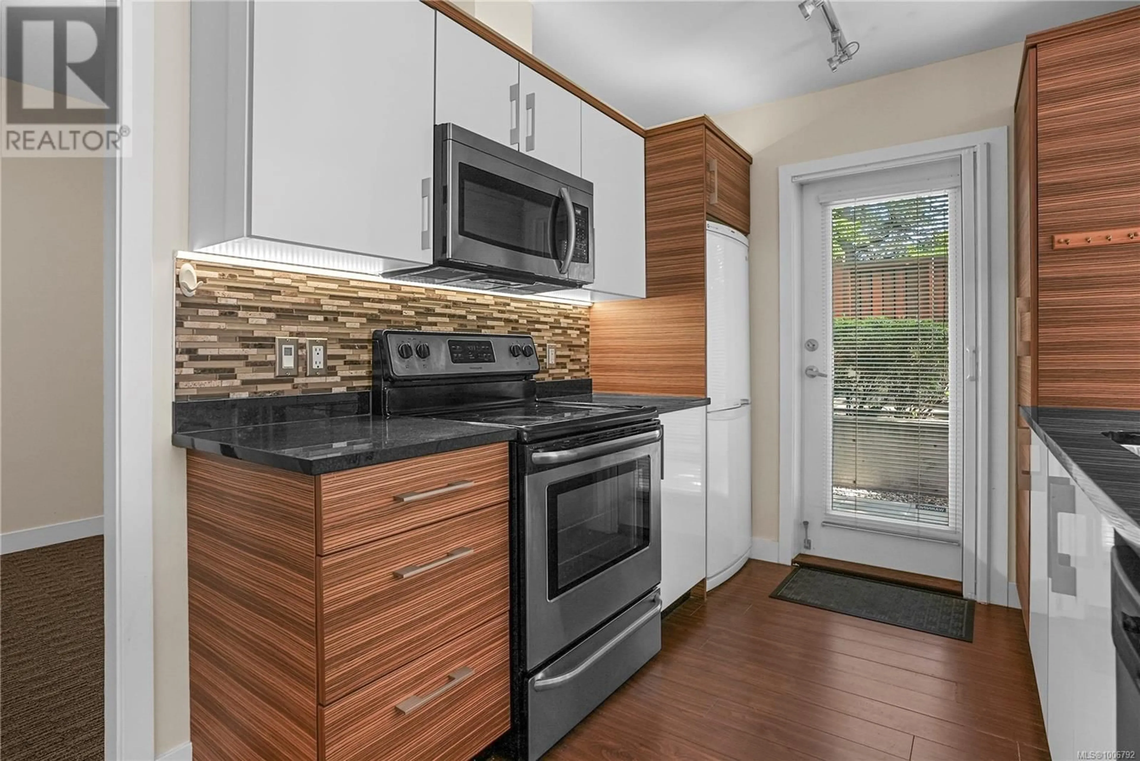 Standard kitchen, wood/laminate floor for 104 - 4030 BORDEN STREET, Saanich British Columbia V8X2E9