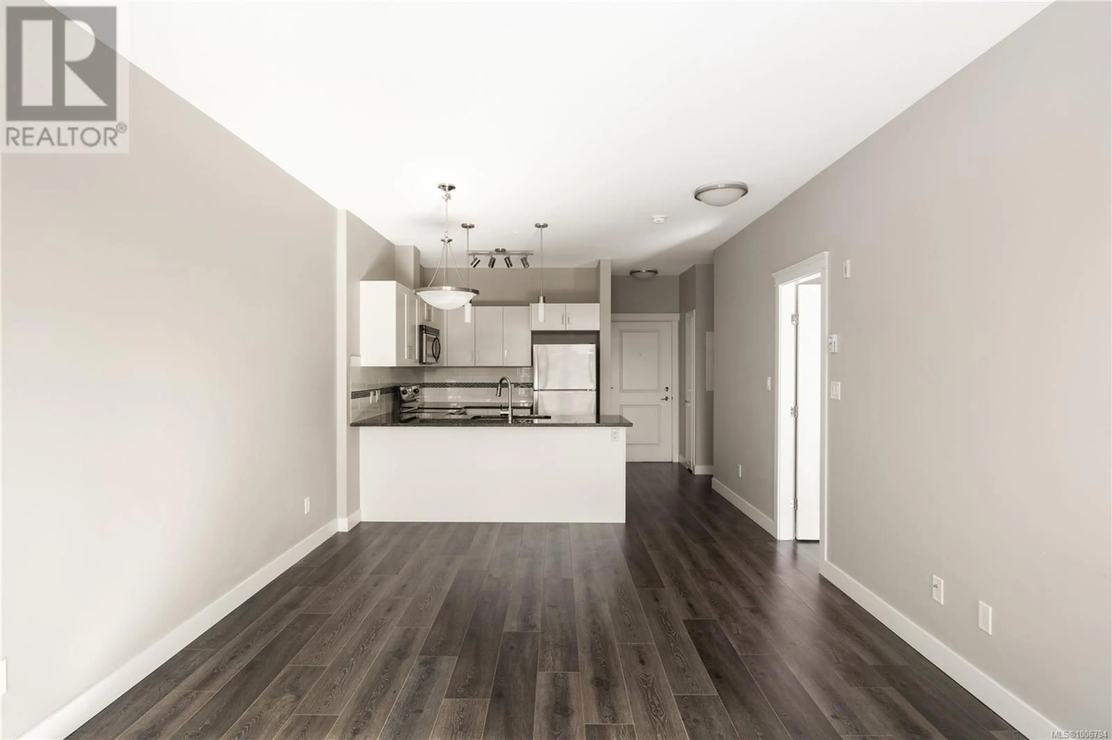 Open concept kitchen, wood/laminate floor for 406 - 844 GOLDSTREAM AVENUE, Langford British Columbia V9B2X8