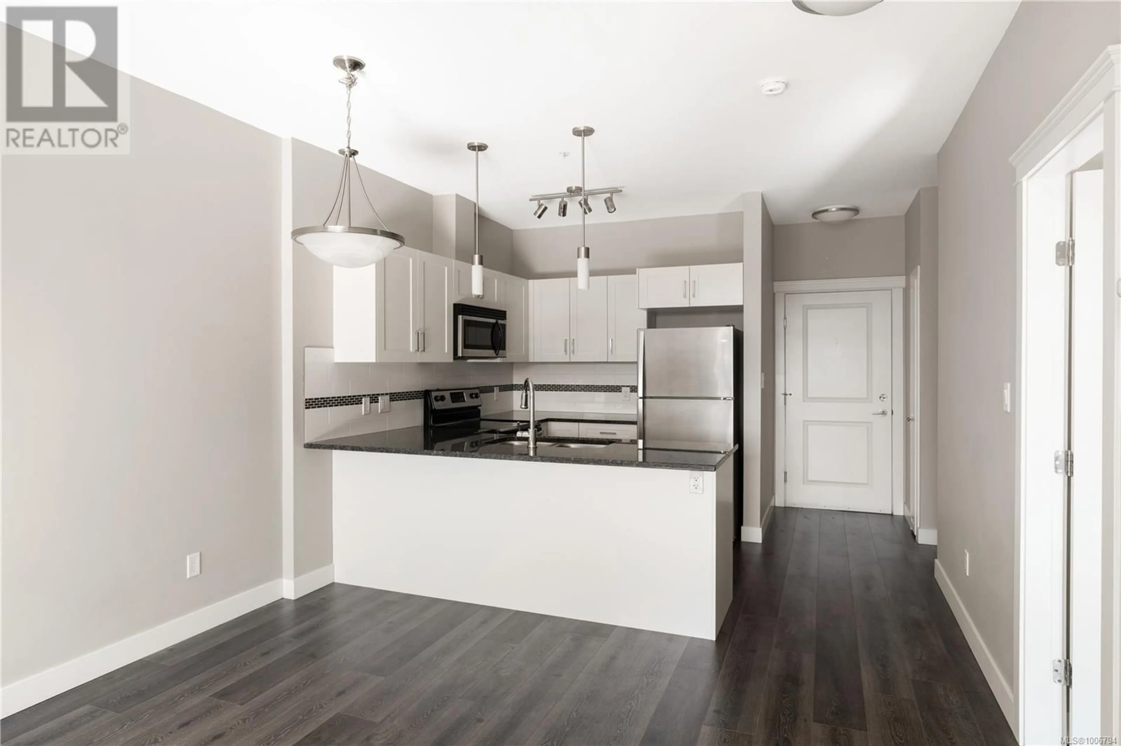 Open concept kitchen, wood/laminate floor for 406 - 844 GOLDSTREAM AVENUE, Langford British Columbia V9B2X8