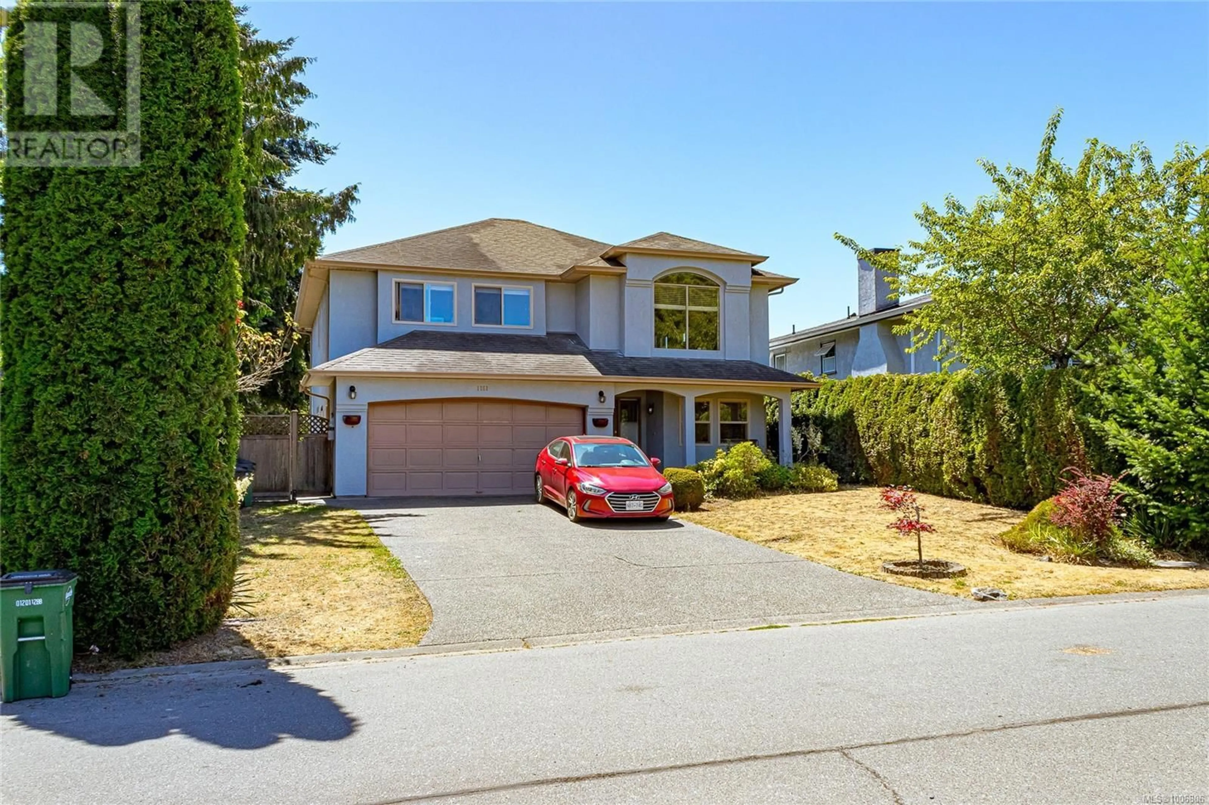 Home with vinyl exterior material, street for 1151 CHERRY ROAD, Saanich British Columbia V8Z7G3