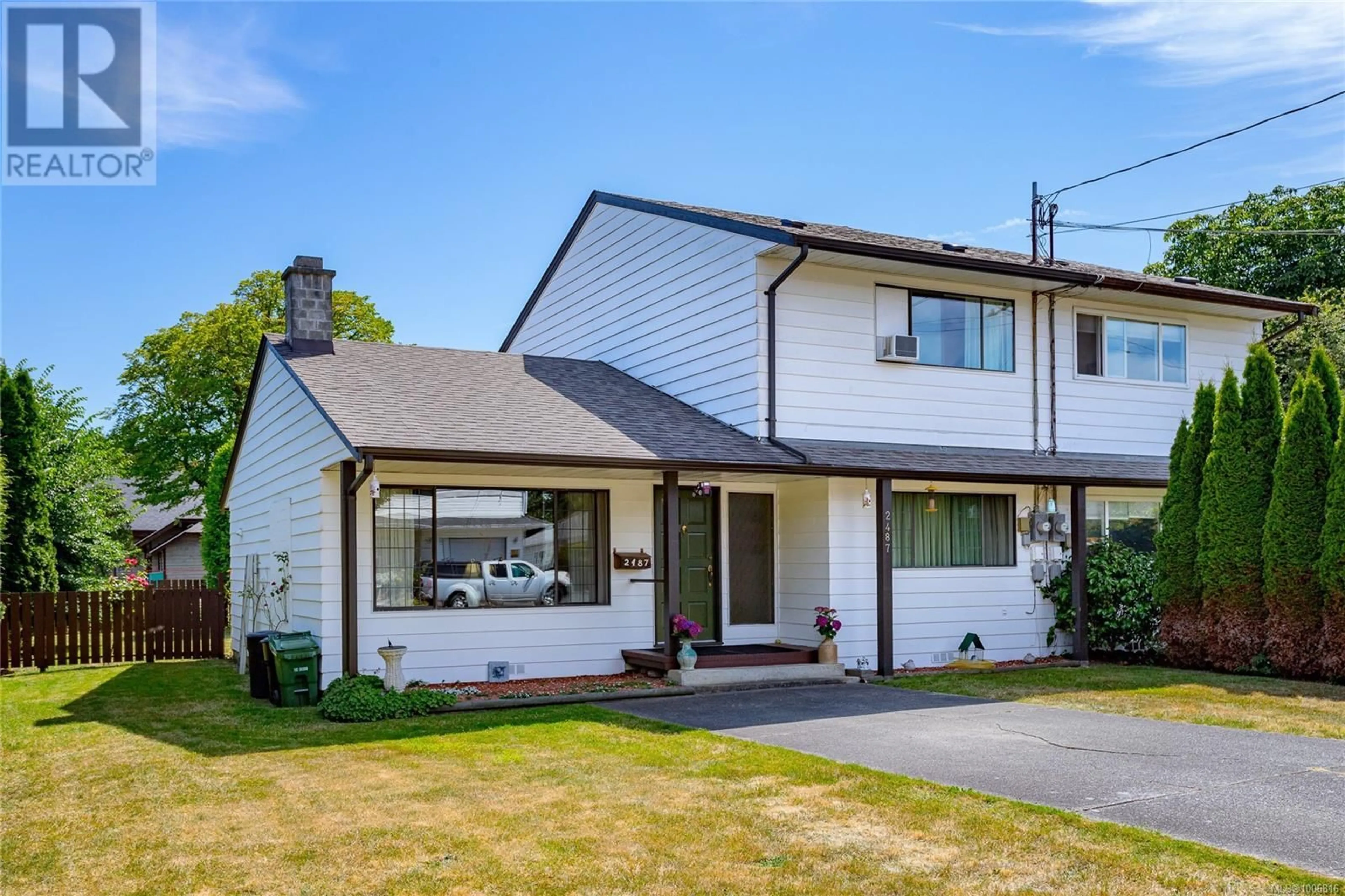 Home with vinyl exterior material, street for 2487 SHOREACRES ROAD, Sidney British Columbia V8L2E3