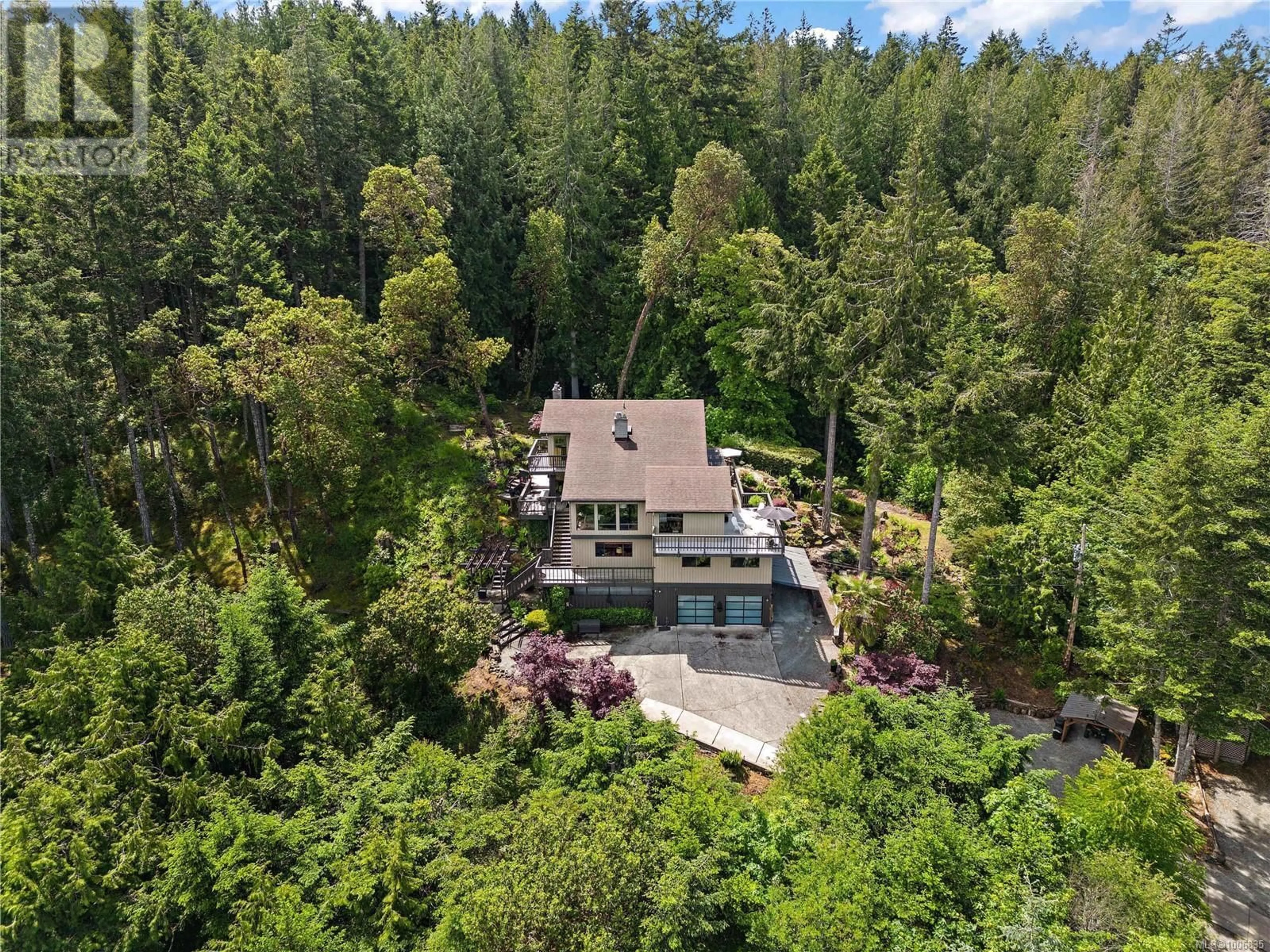 A pic from outside/outdoor area/front of a property/back of a property/a pic from drone, forest/trees view for 1595 EAGLE WAY, North Saanich British Columbia V8L5S3