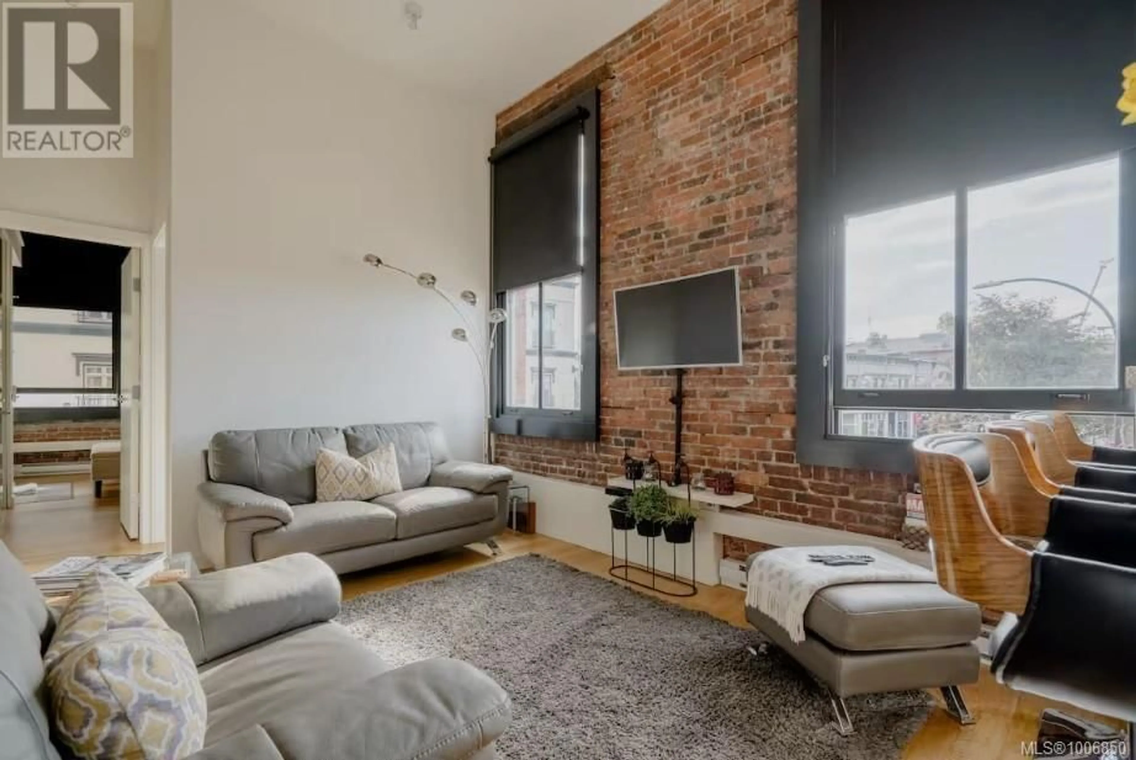 Living room with furniture, cement floor for 225 - 1610 STORE STREET, Victoria British Columbia V8W0E3
