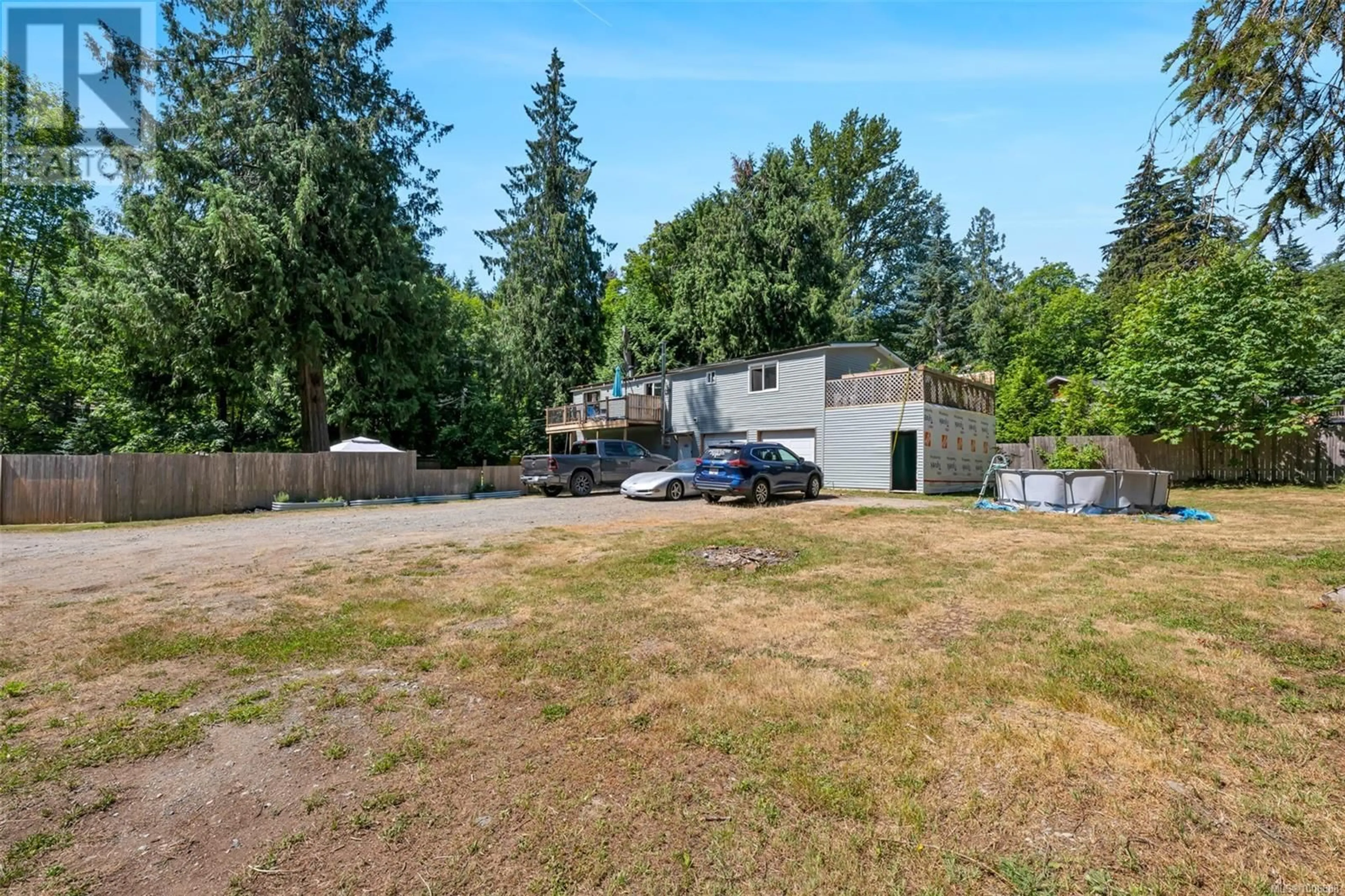 A pic from outside/outdoor area/front of a property/back of a property/a pic from drone, street for 4547 COWICHAN LAKE ROAD, Duncan British Columbia V9L5J4