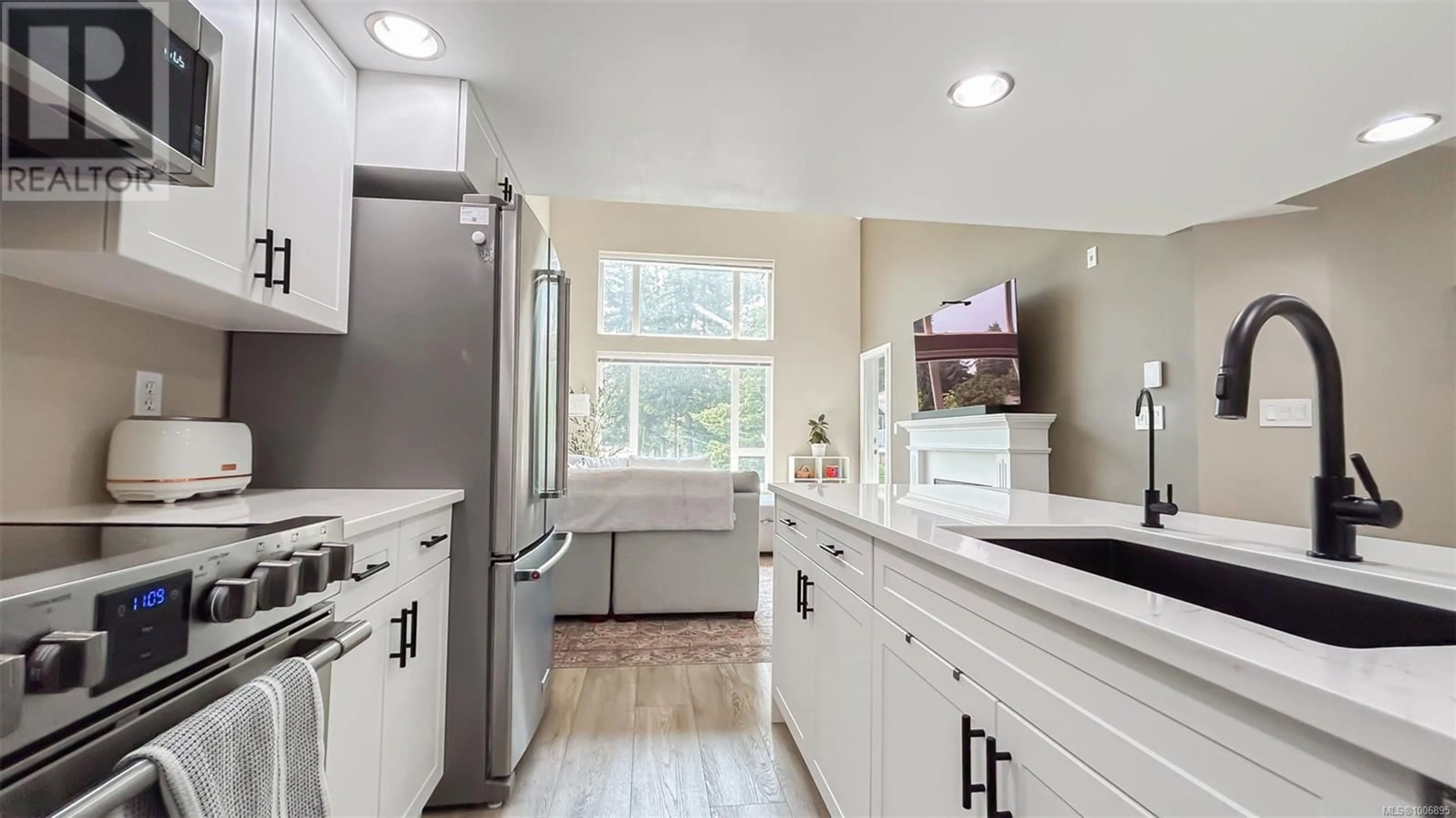 Open concept kitchen, ceramic/tile floor for 403 - 2823 JACKLIN ROAD, Langford British Columbia V9B3Y1
