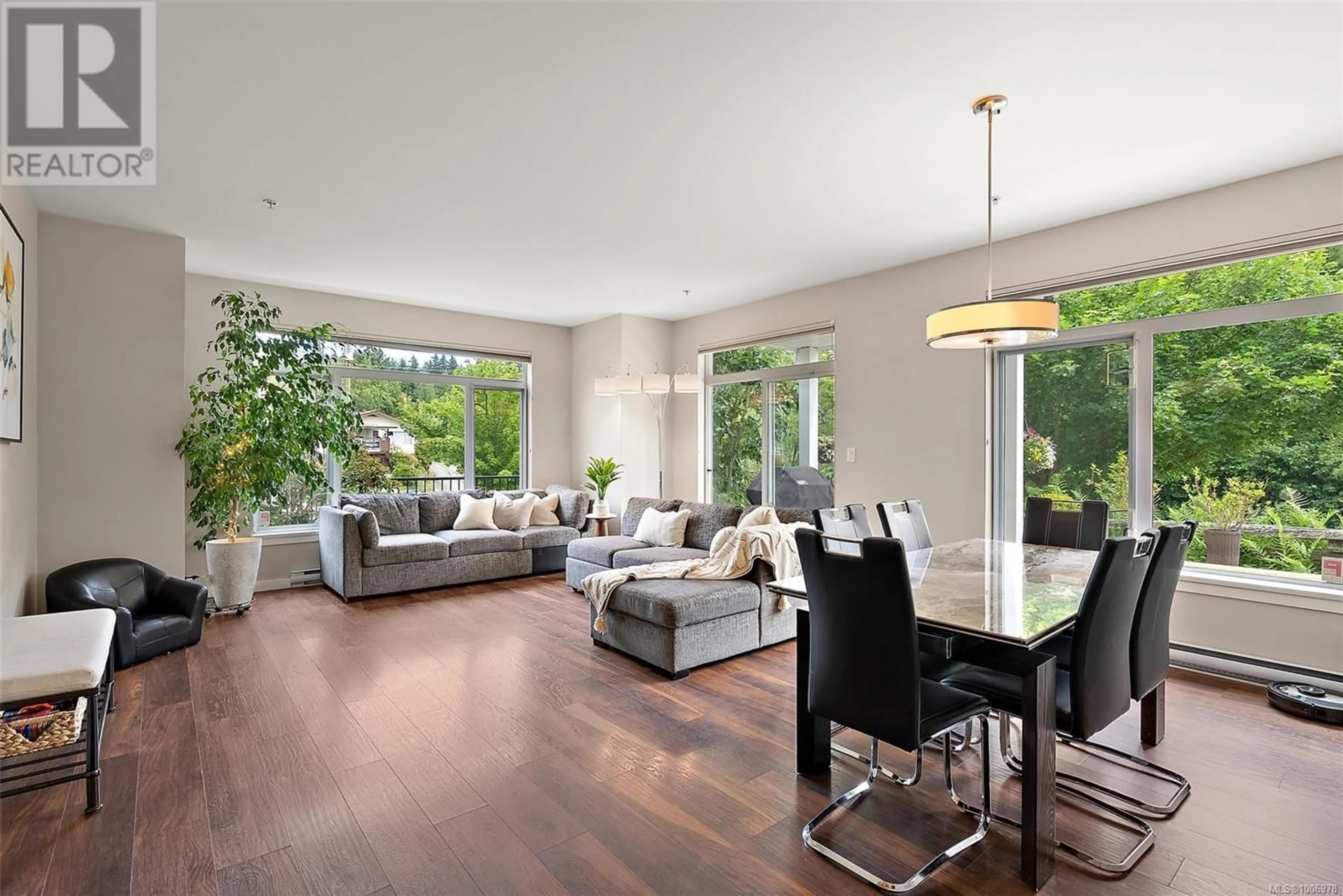 Living room with furniture, wood/laminate floor for 101 - 591 LATORIA ROAD, Colwood British Columbia V9C2Z9