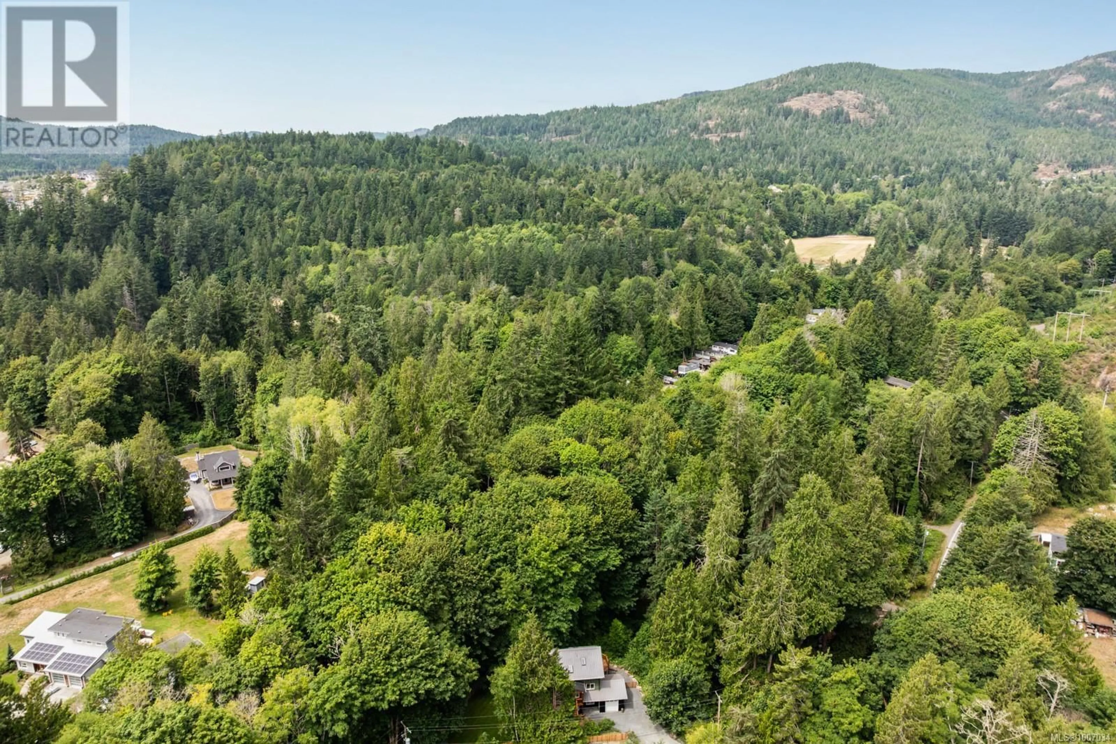 A pic from outside/outdoor area/front of a property/back of a property/a pic from drone, forest/trees view for 2590 SOOKE RIVER ROAD, Sooke British Columbia V0S1N0