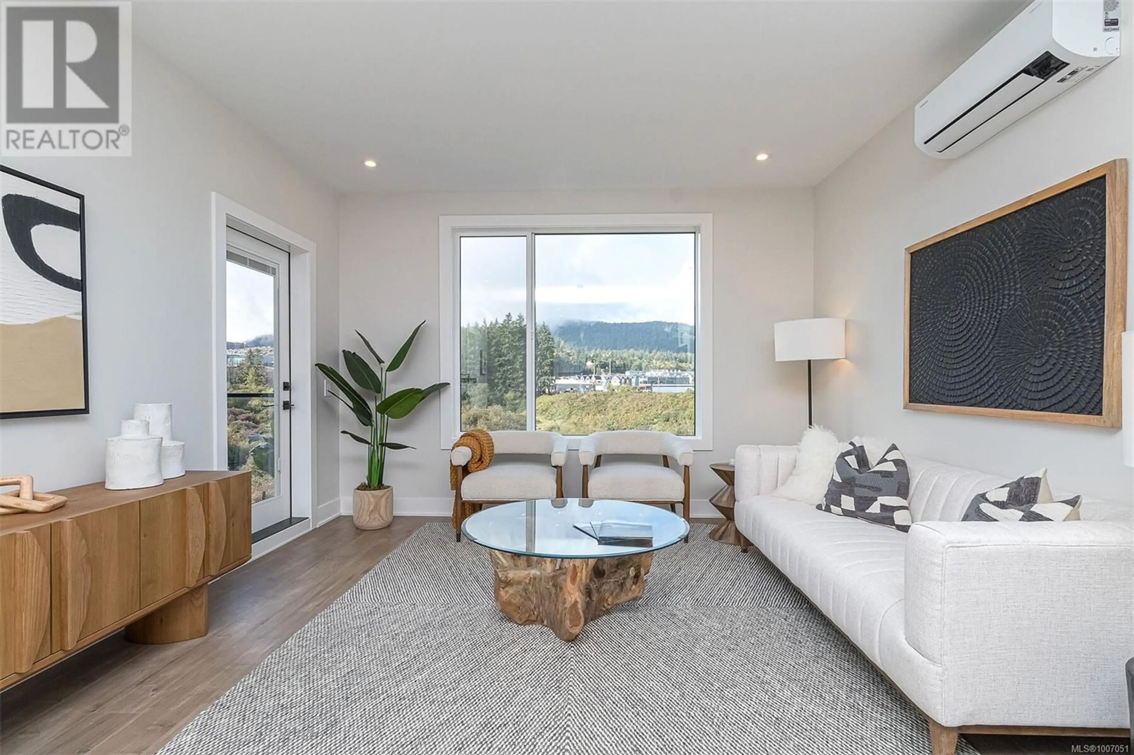 Living room with furniture, wood/laminate floor for 615 - 1361 GOLDSTREAM AVENUE, Langford British Columbia V9B7B4