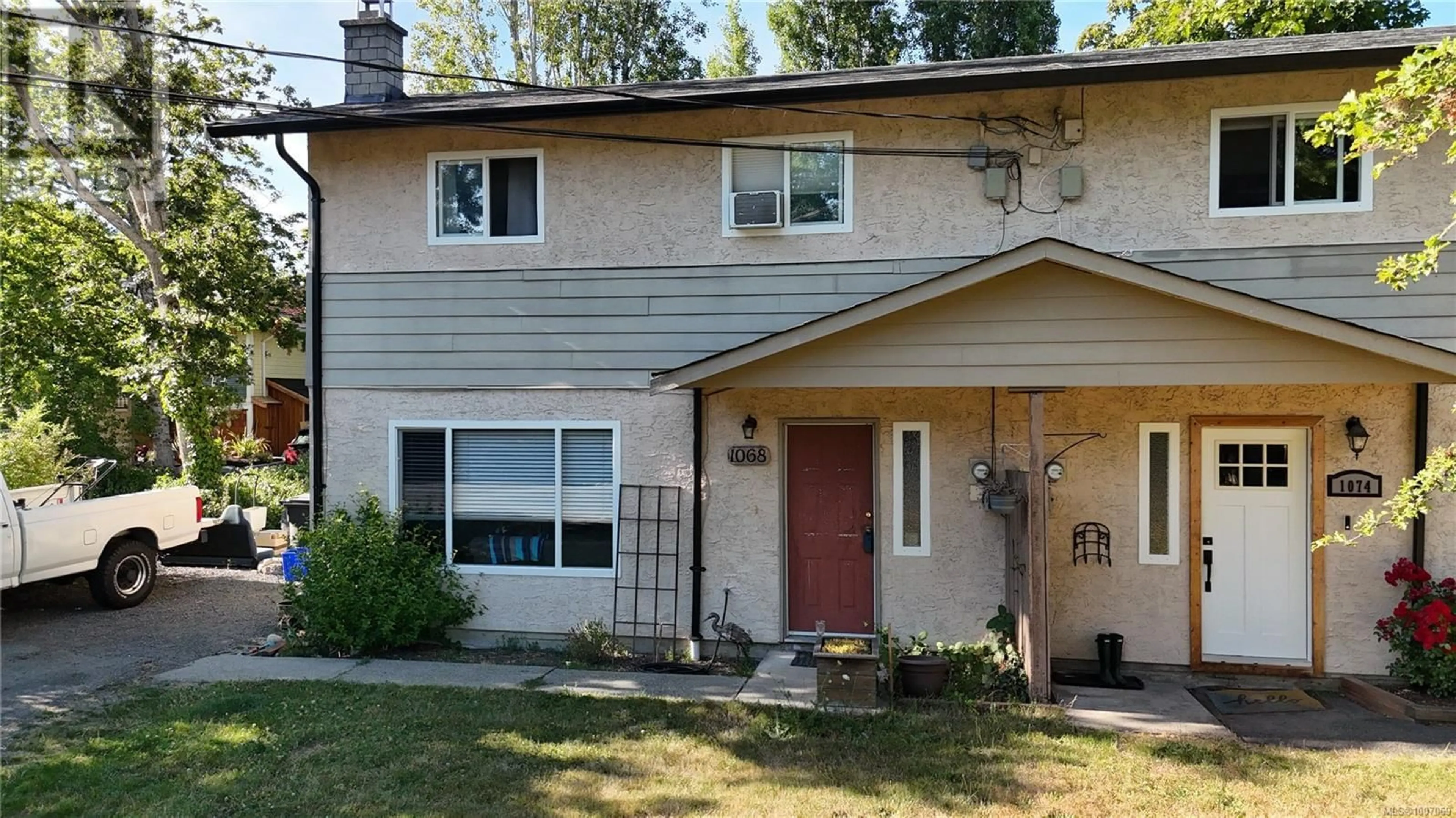 Home with vinyl exterior material, street for 1068 CLARKE ROAD, Central Saanich British Columbia V8M1C7