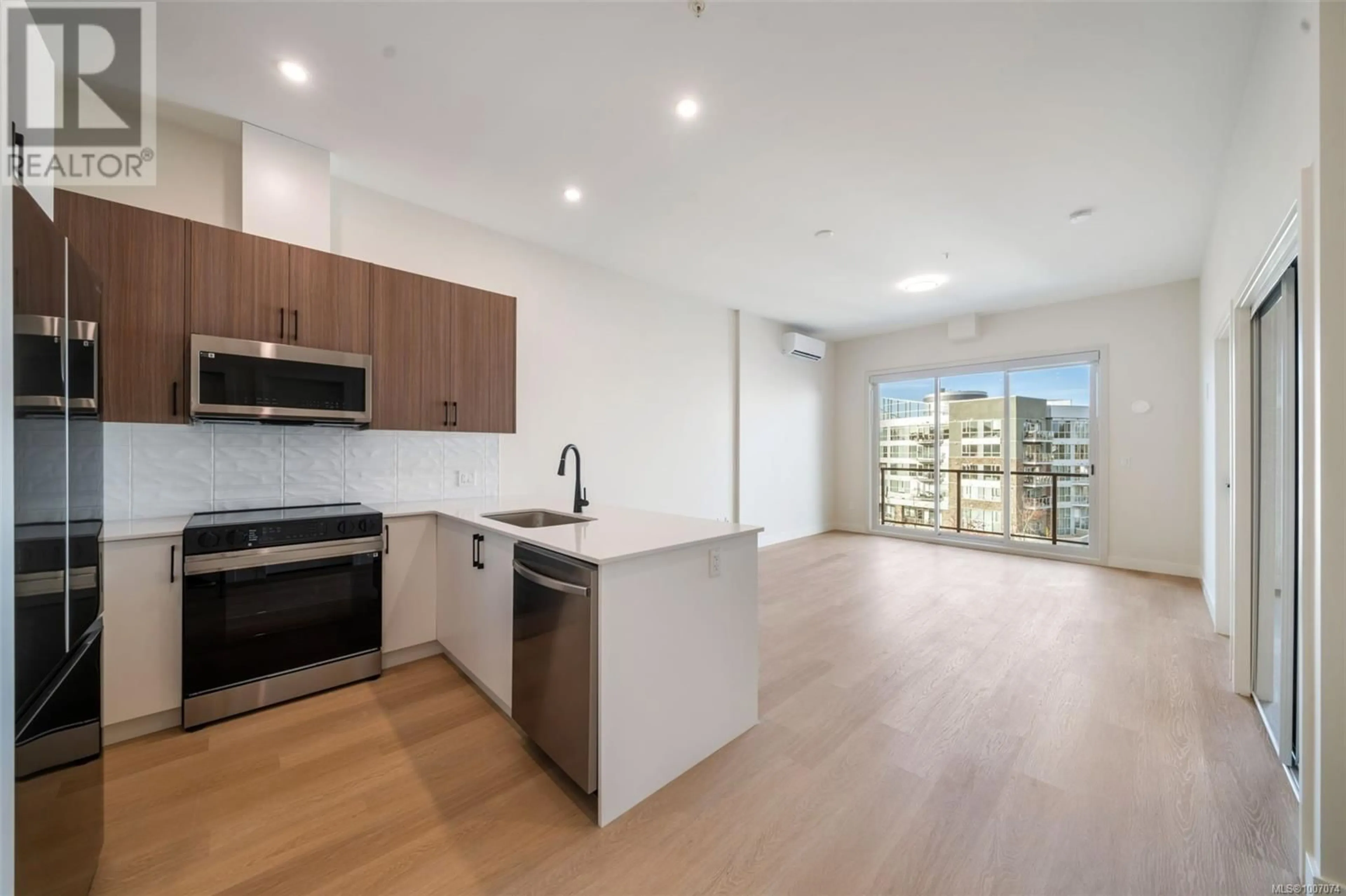 Open concept kitchen, wood/laminate floor for 508 - 2770 WINSTER ROAD, Langford British Columbia V9B7C7